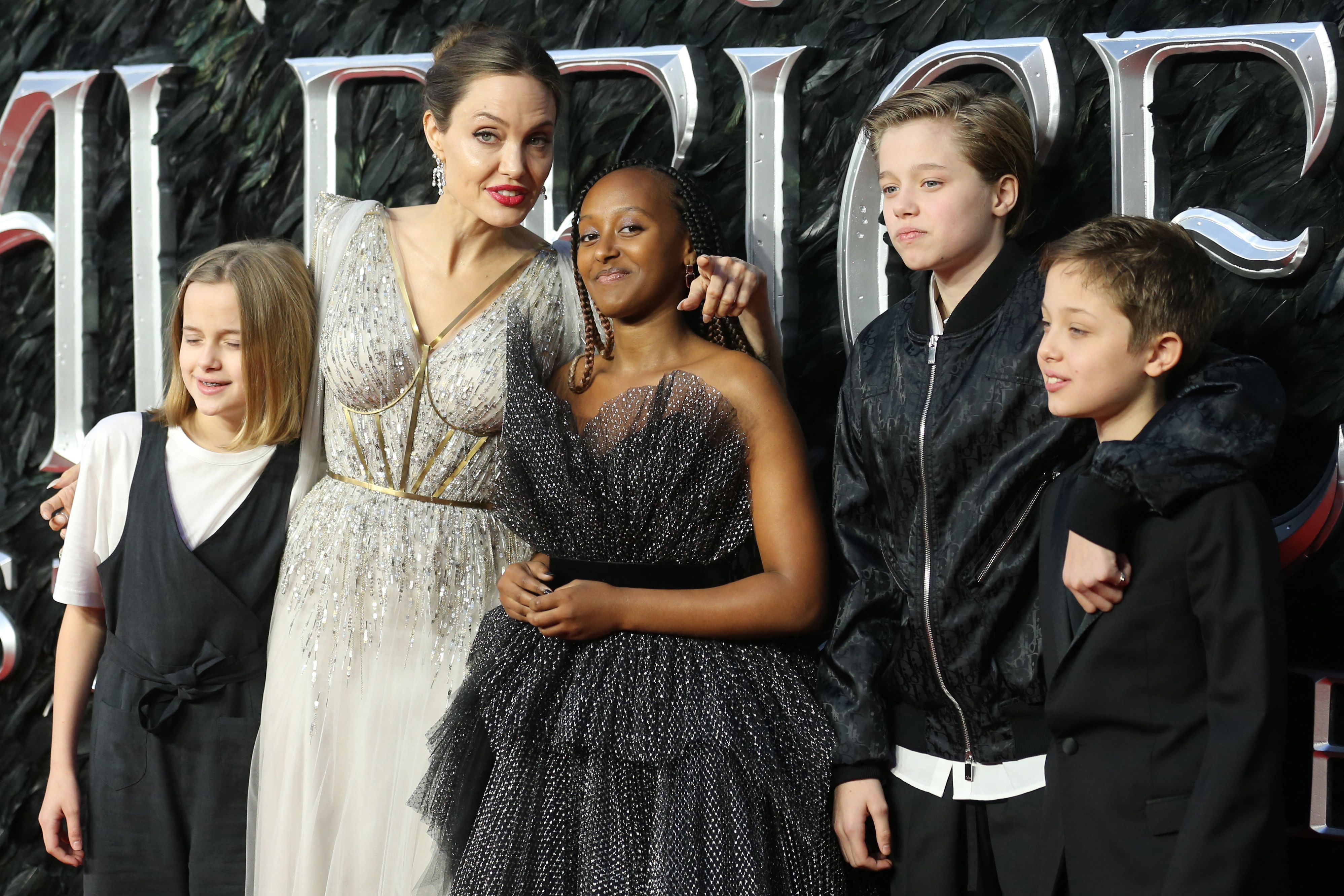 Angelina Jolie poses with her children on the red carpet at the European premiere of the film "Maleficent: Mistress of Evil" in London on October 9, 2019 | Source: Getty Images