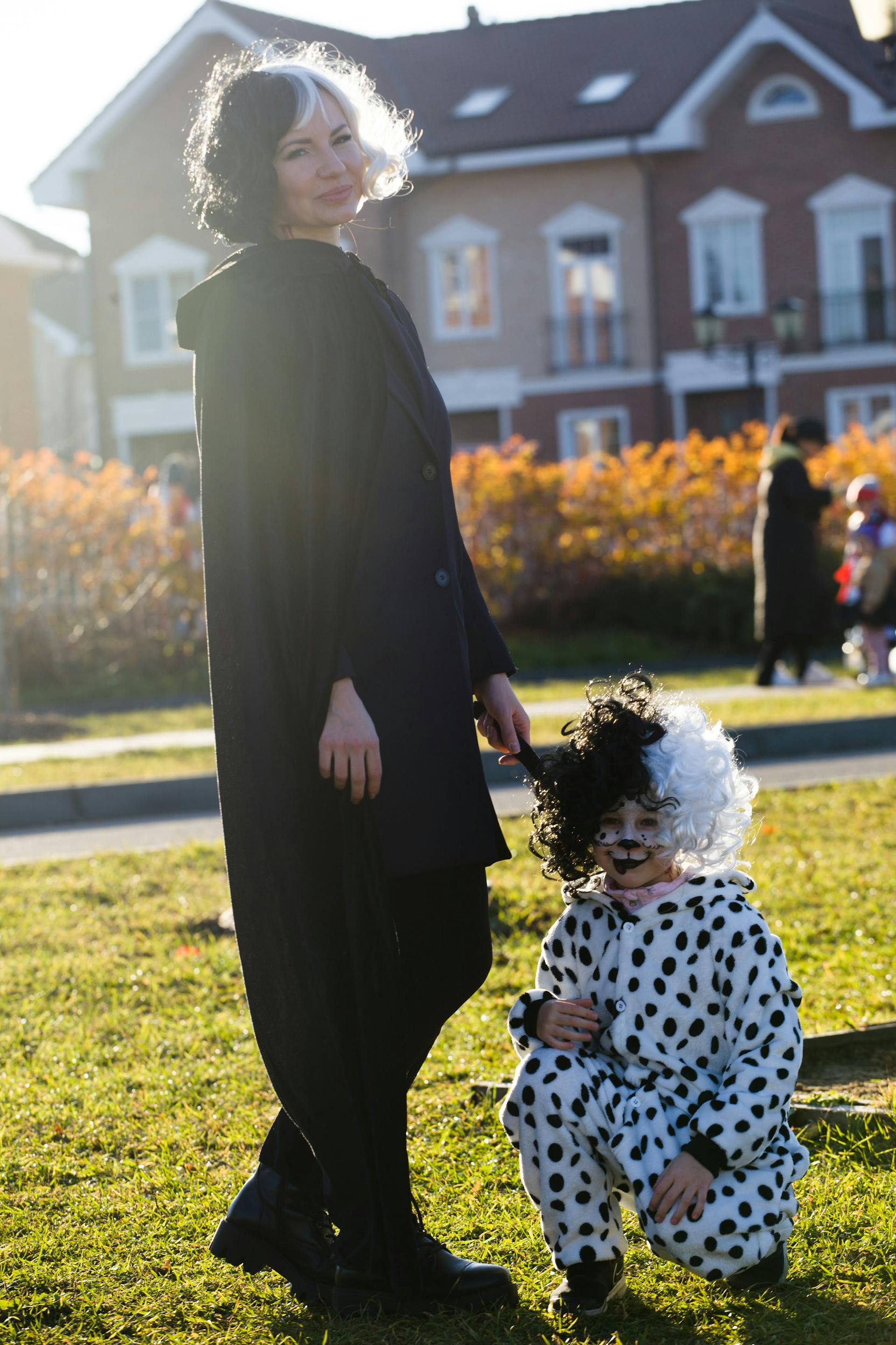 A woman and her child wearing Halloween costumes | Source: Pexels