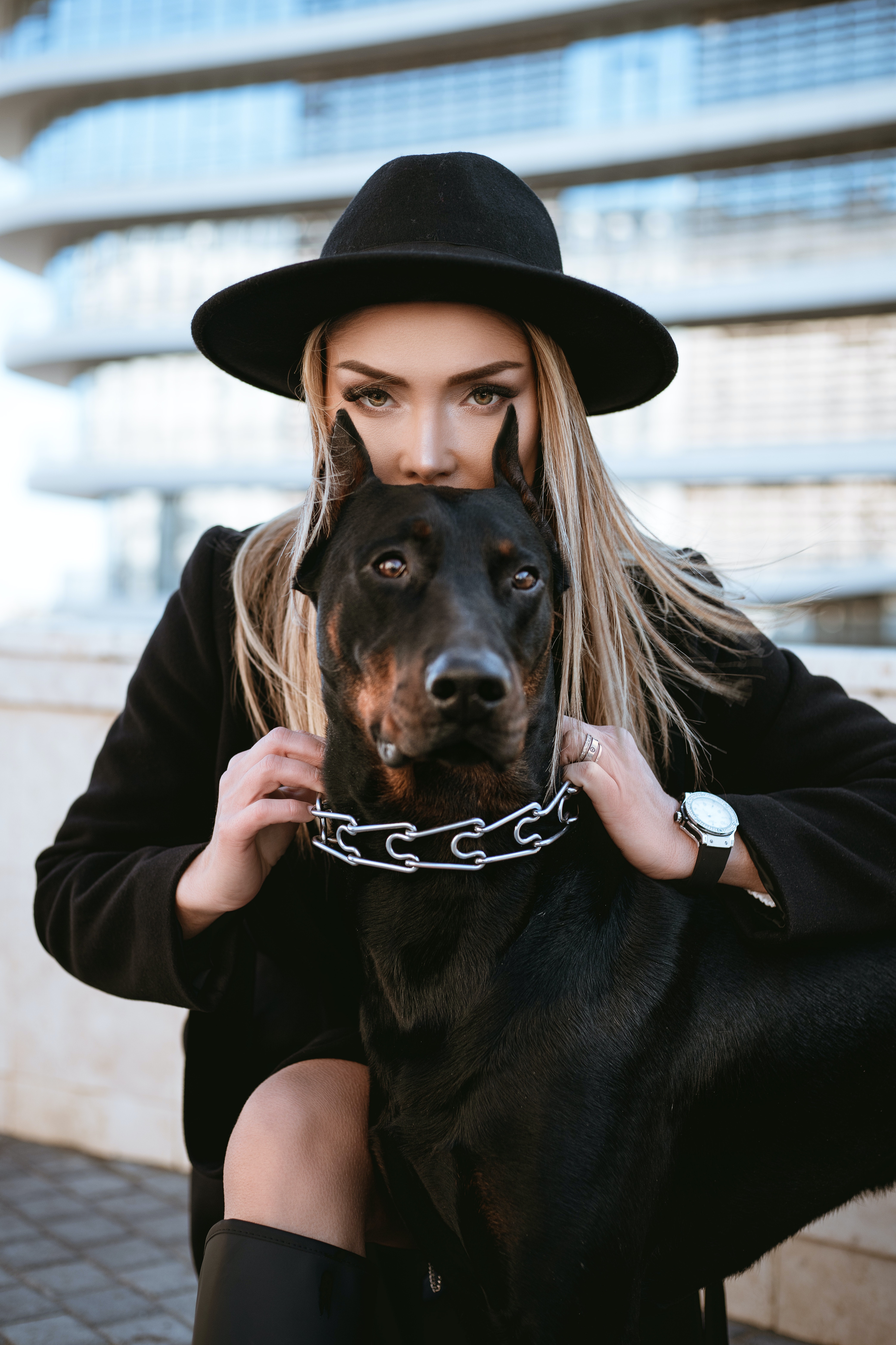 A woman with a Doberman Pinscher │ Source: Pexels