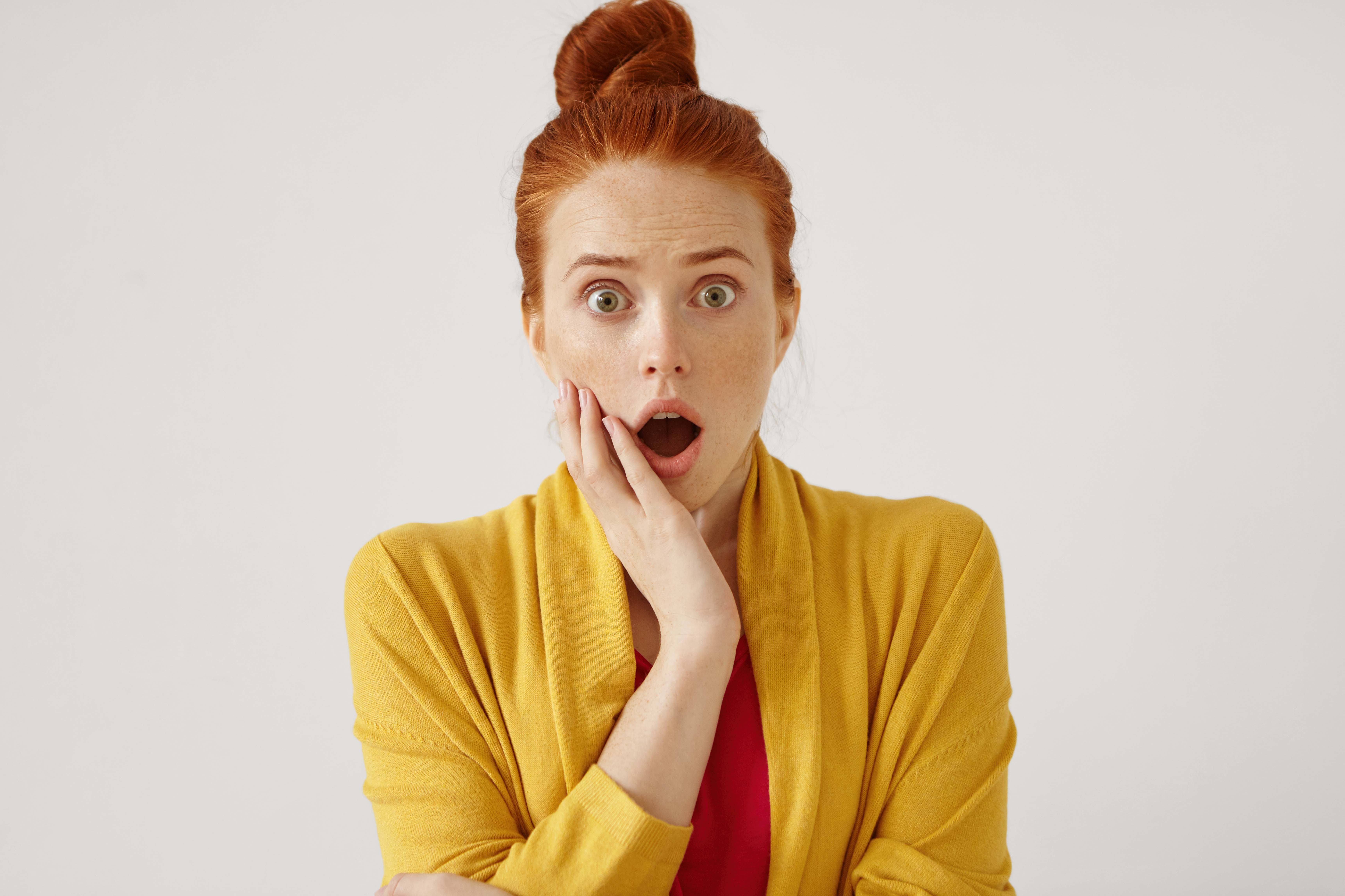 A shocked woman | Source: Freepik