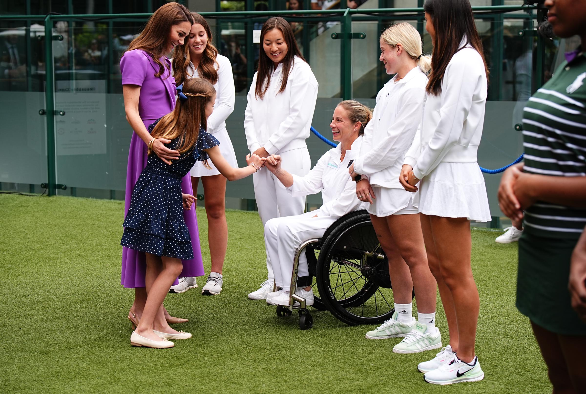 Kate Middleton and Princess Charlotte meet Lucy Shuker during a visit to the All England Lawn Tennis and Croquet Club on July 14, 2024, in London, England. | Source: Getty Images