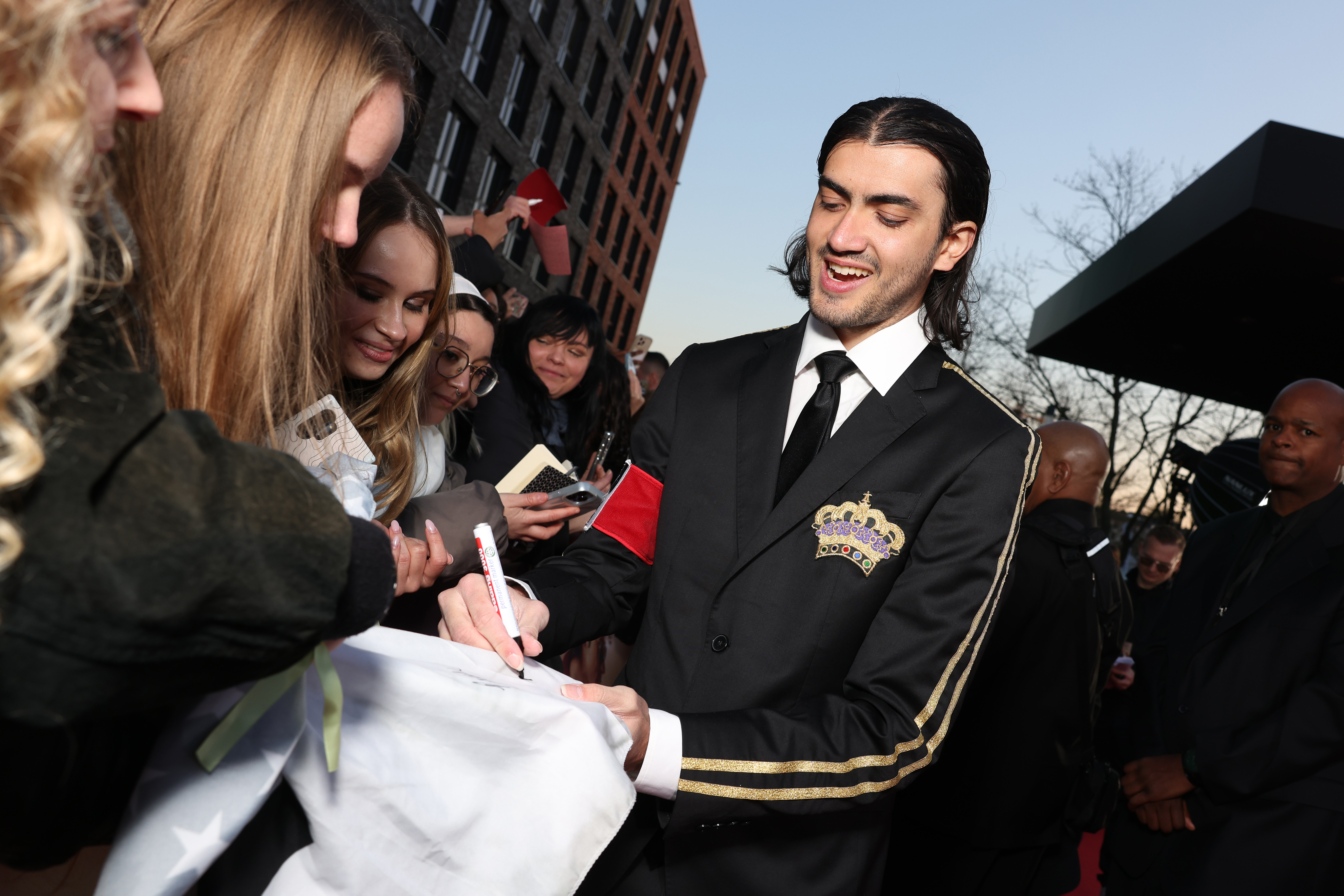 Bigi Jackson signs autographs for fans during the "Michael" premiere at Uber Eats Music Hall on April 10, 2026, in Berlin, Germany.