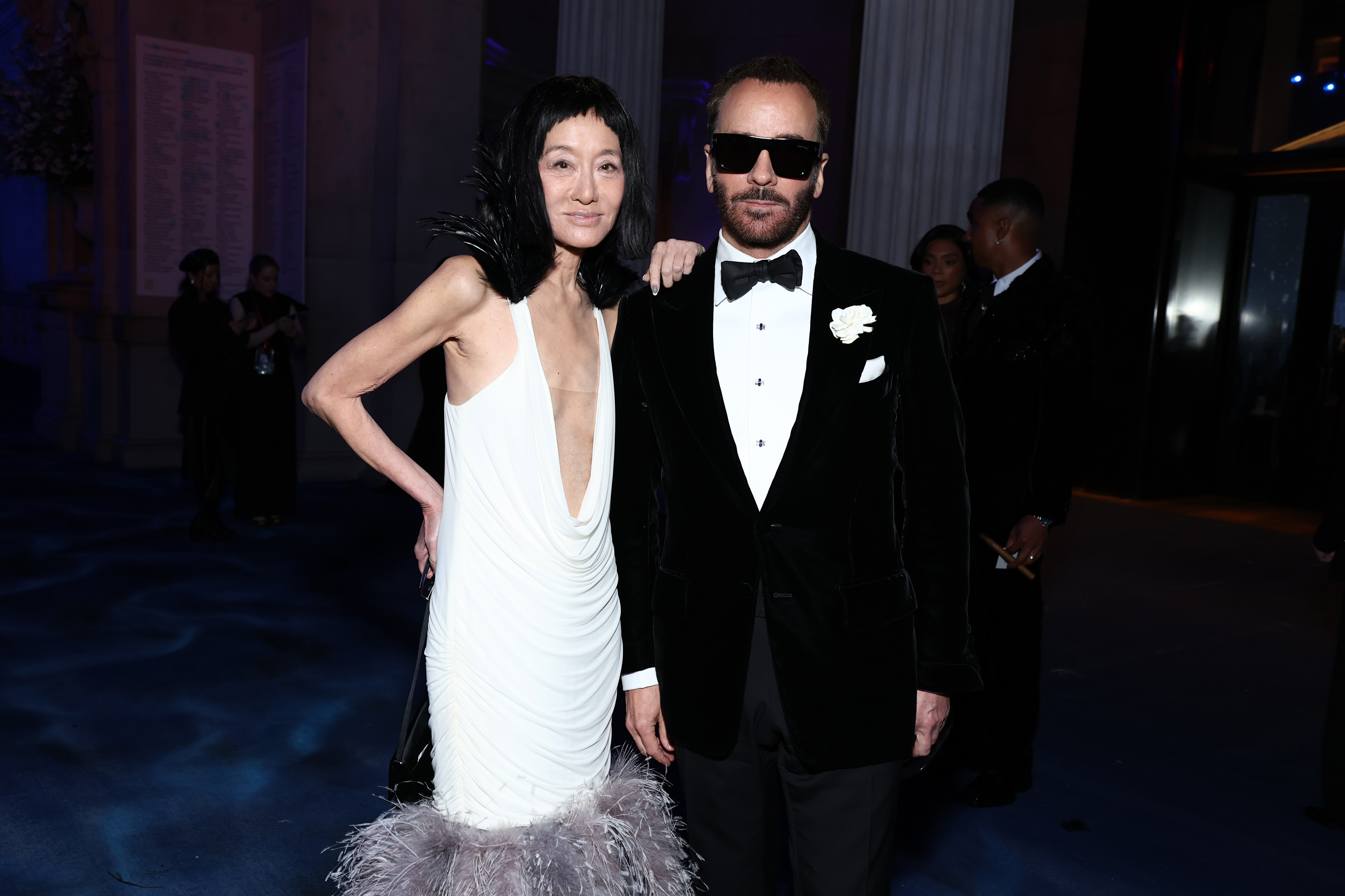 Vera Wang stands beside designer Tom Ford, both dressed in black-and-white ensembles that nod to timeless glamour during the evening's high-profile gathering.