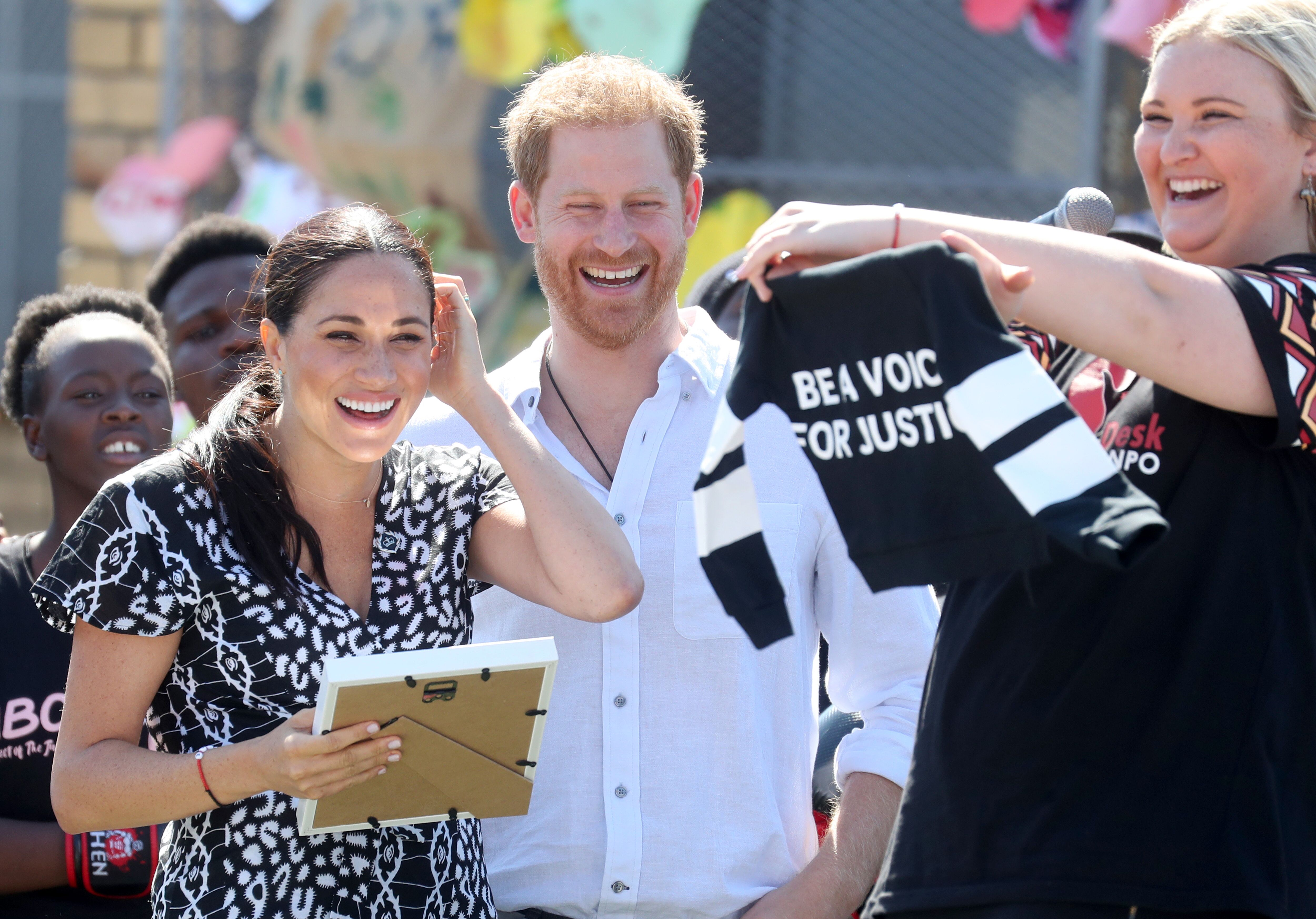 Meghan Markle and Prince Harry visits a Justice Desk initiative in Nyanga. | Source: Getty Images