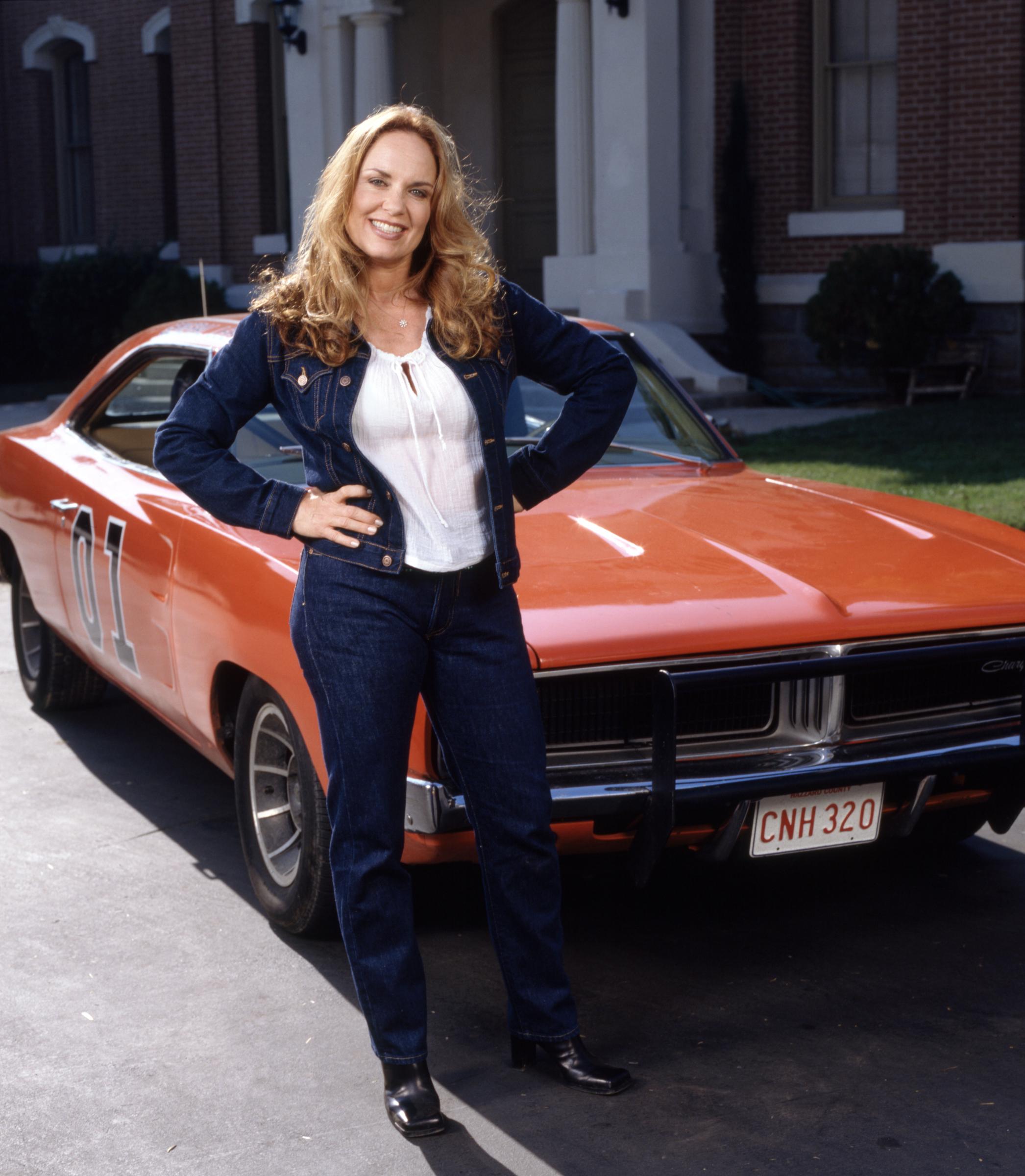 Catherine Bach as her character Daisy Duke on the set of the TV movie "The Dukes of Hazzard: Hazzard in Hollywood" in Los Angeles, California on October 19, 1999. | Source: Getty Images