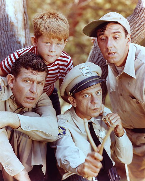 Andy Griffith as Sheriff Andy Taylor, Jim Nabors as Gomer Pyle, Ron Howard as Opie Taylor and Don Knotts as Deputy Barney Fife in 'The Andy Griffith Show', circa 1963 | Photo: GettyImages