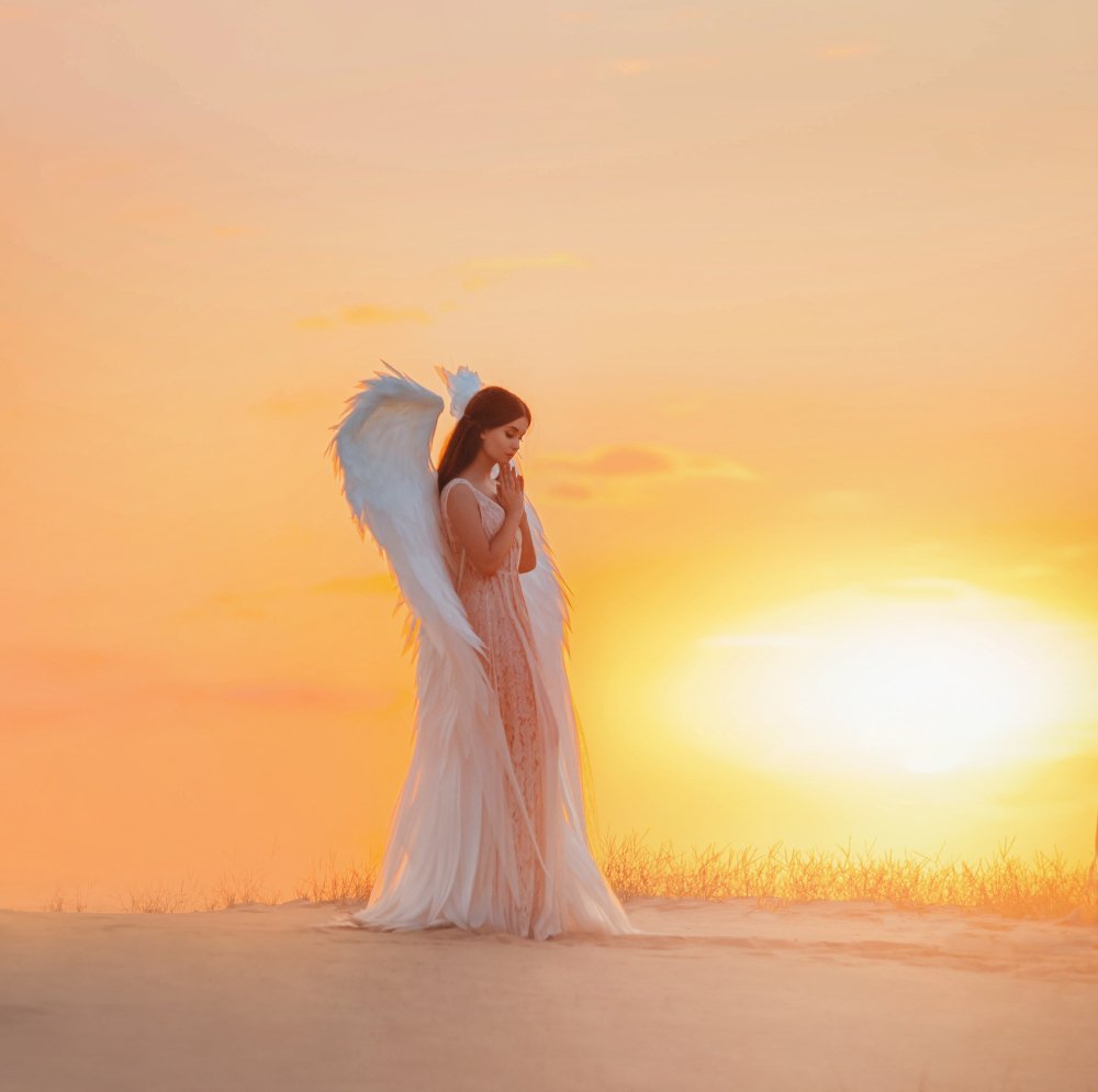 A silhouette of a young woman angel. | Photo: Shutterstock