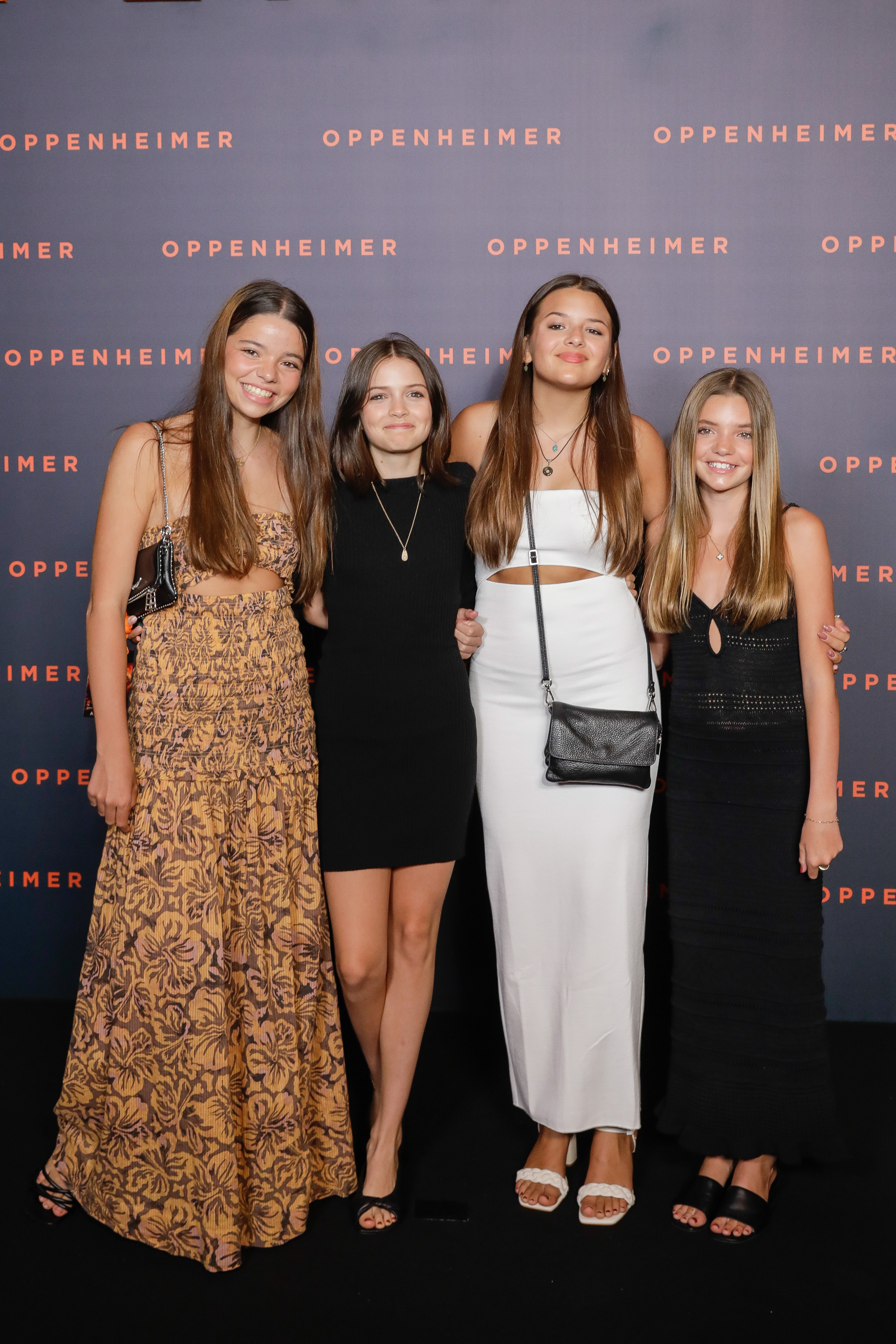 Matt Damon's daughters — Alexia Barroso, Isabella Damon, Gia Damon, and Stella Damon — pose together at the Paris premiere of "Oppenheimer" in 2023. | Source: Getty Images