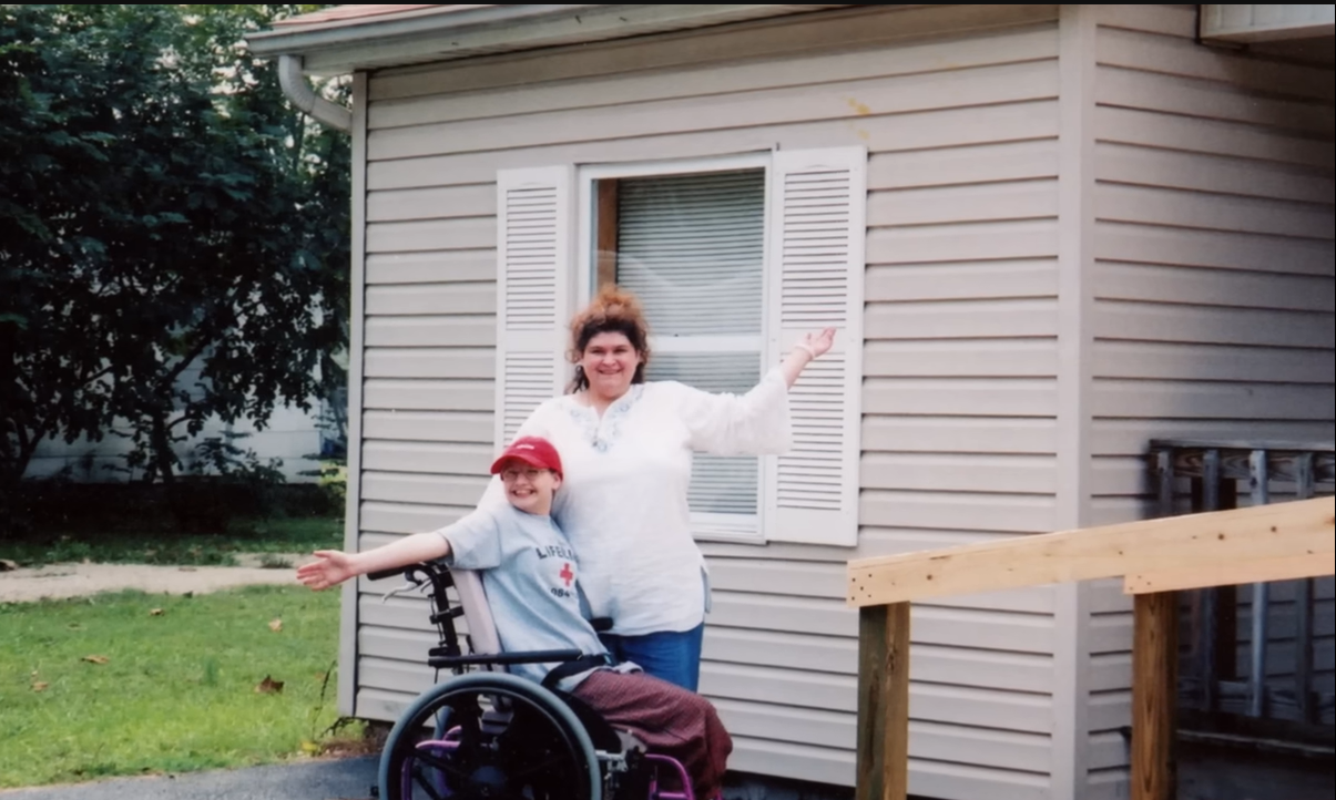 Dee Dee and Gypsy Rose Blanchard pose at the bottom of the wheelchair ramp, from a video dated January 13, 2024 | Source: YouTube/@AETV