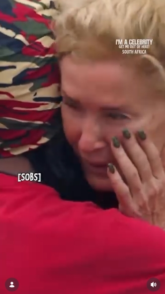 Overcome with emotion, Beverley Callard is seen wiping away tears as she leans into a campmate's embrace during her heartbreaking exit, a moment shared in a post dated 21 April 2026 that captured the raw intensity of her departure from the jungle. | Source: Instagram/imacelebrity