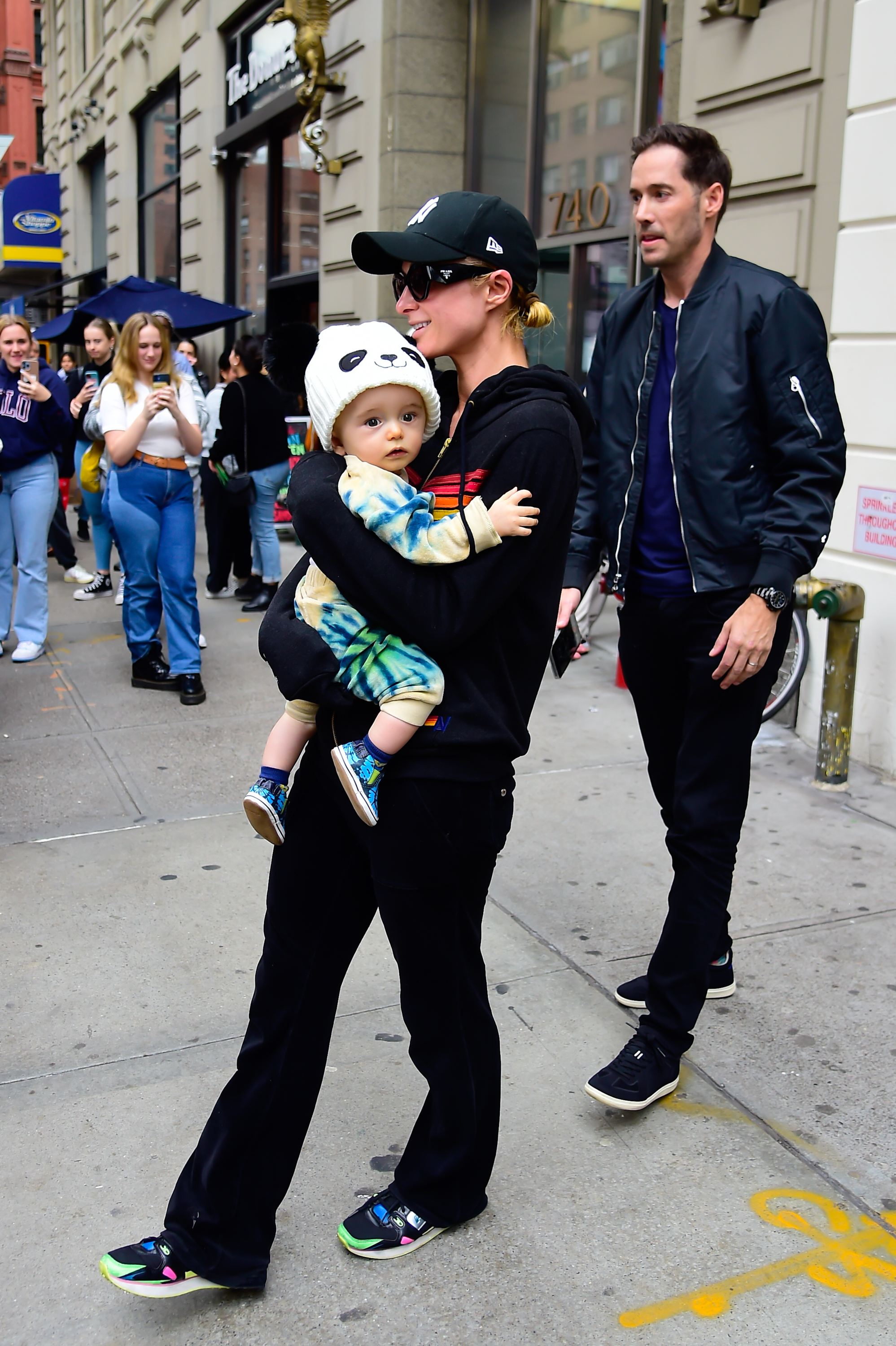 Paris Hilton and Carter Reum with their son Phoenix, spotted in New York City on October 18, 2023 | Source: Getty Images