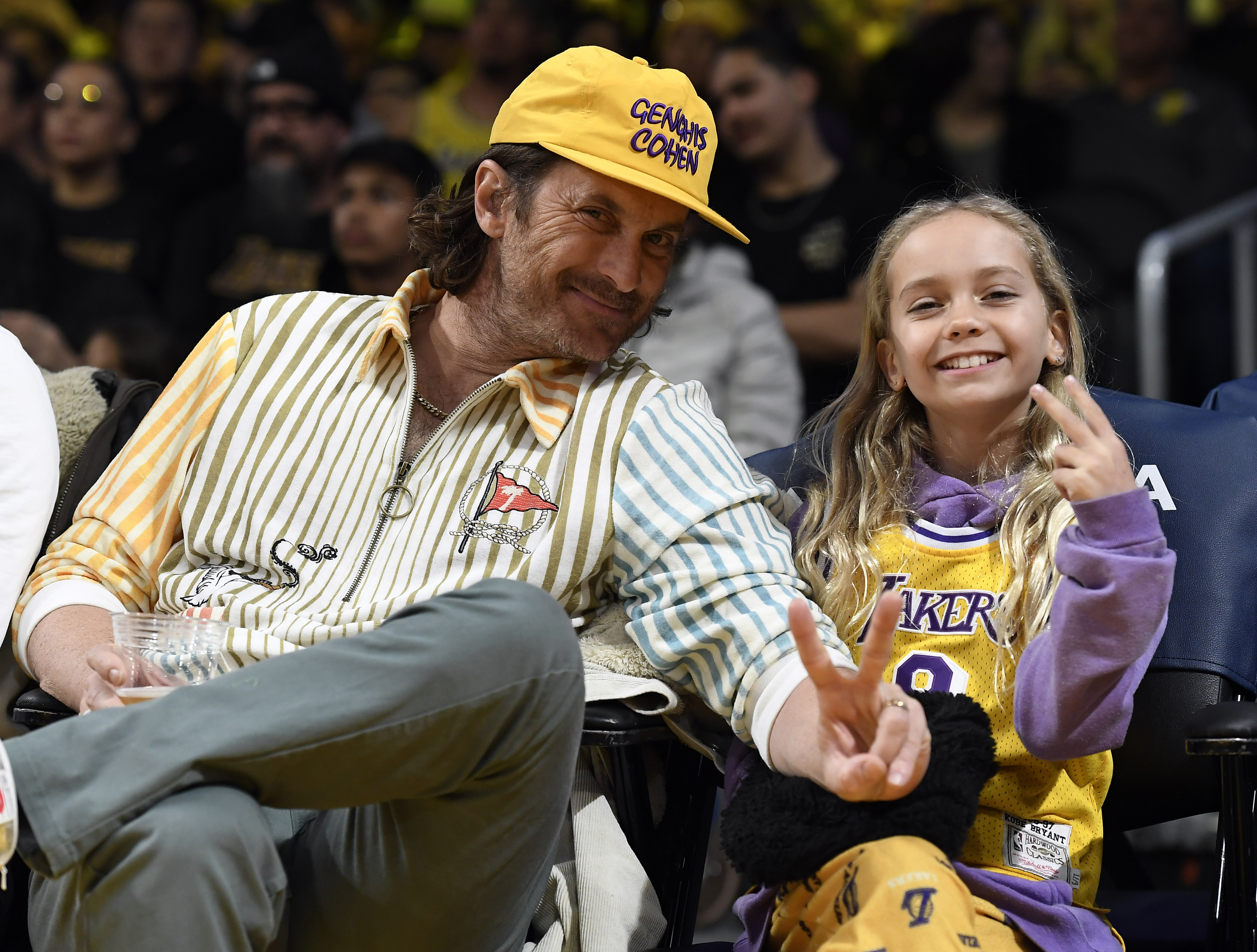 Oliver Hudson and daughter Rio showed their team spirit courtside at the Lakers vs. Raptors game on March 10, 2023. Rio proudly wore a Lakers jersey as the duo enjoyed the action at Crypto.com Arena in Los Angeles.