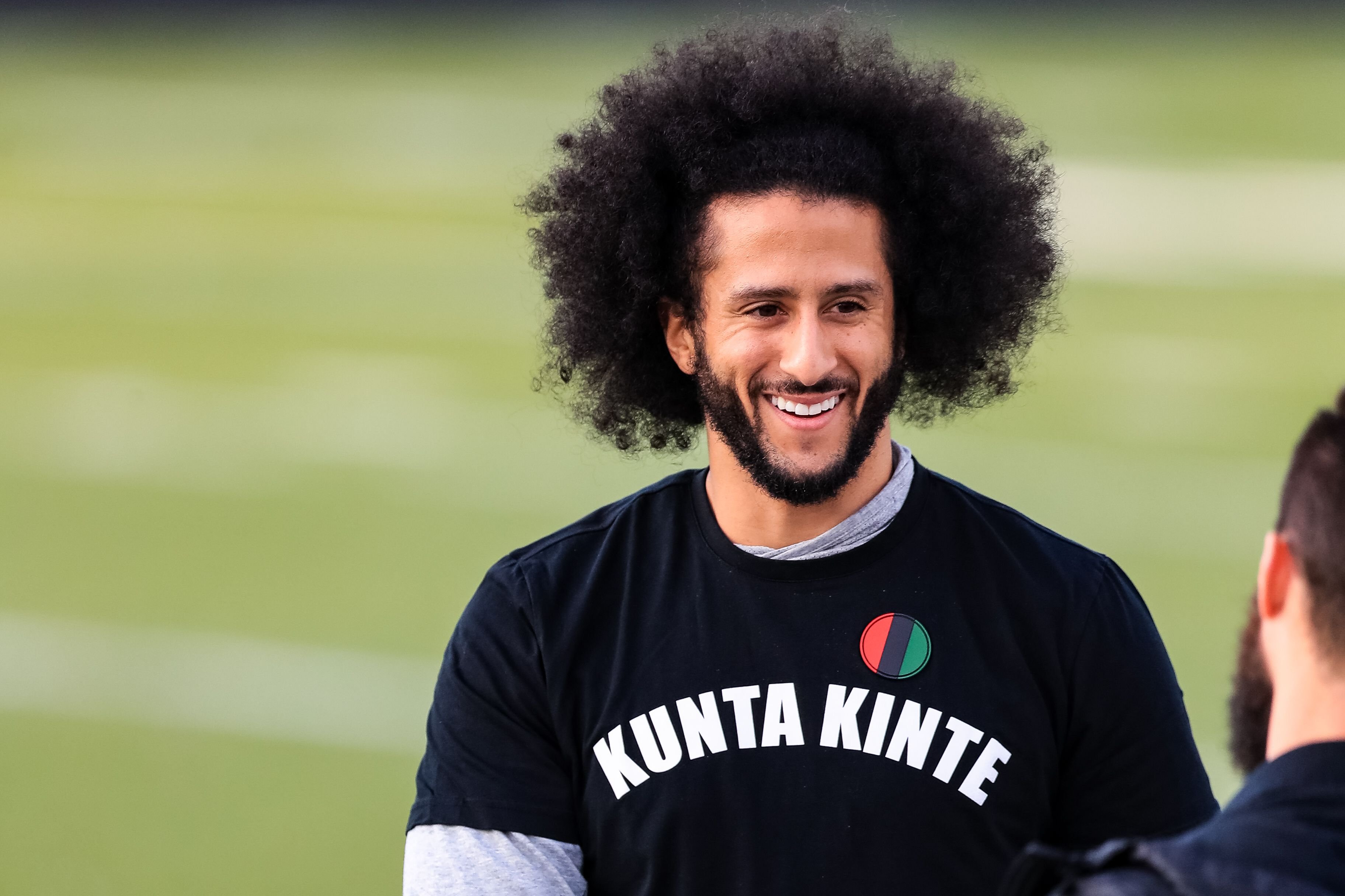 Colin Kaepernick looks on during his NFL workout held at Charles R Drew high school on November 16, 2019 in Riverdale, Georgia. | Source: Getty Images