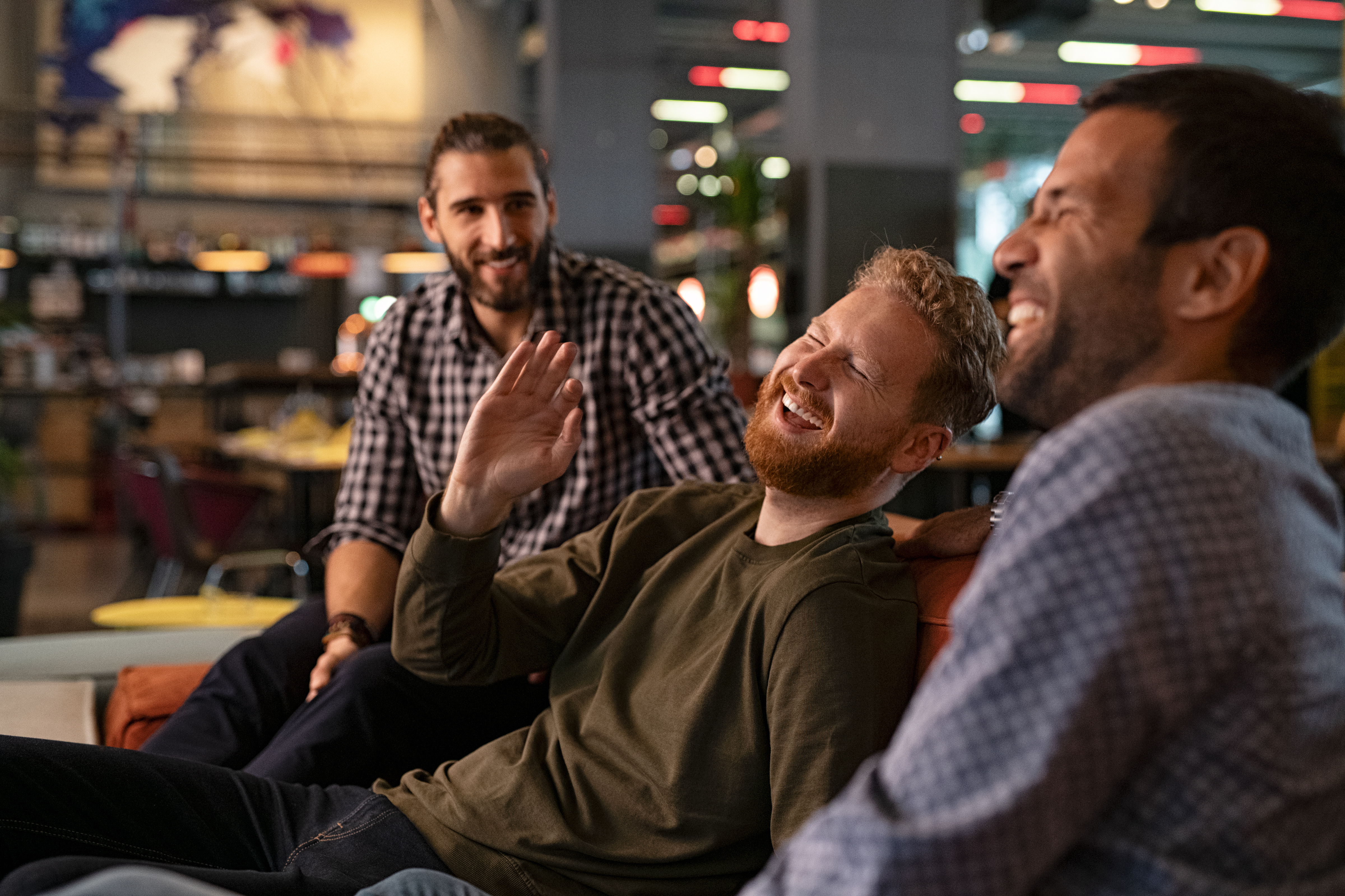 Men laughing together | Source: Getty Images