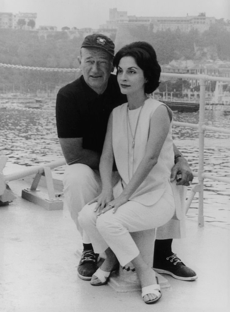 John Wayne and his wife Pilar on board their yacht 'The Wild Goose' at Monte Carlo, on 26th August 1963 | Photo: Getty Images