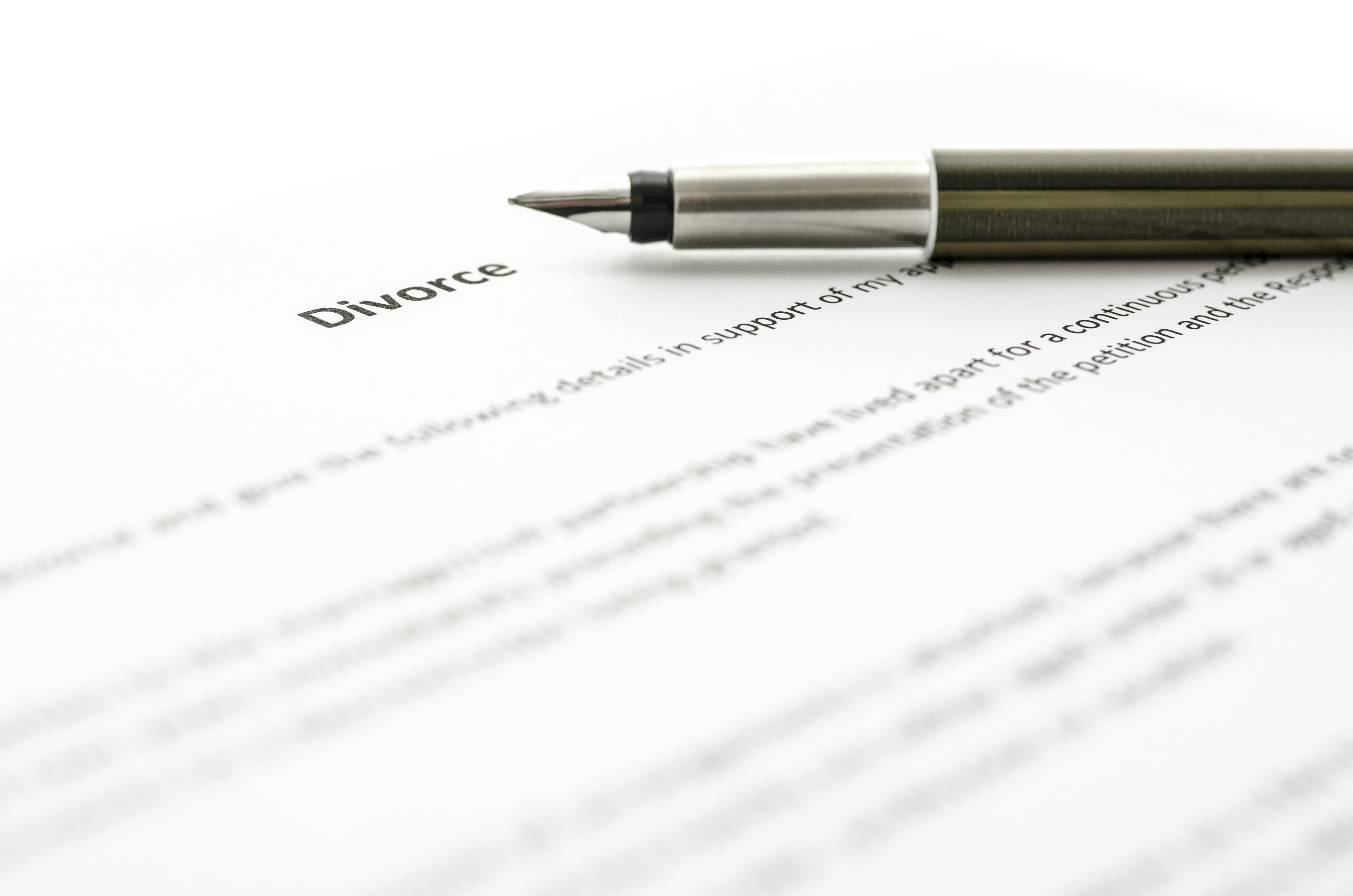 Detail of signing divorce papers | Source: Shutterstock