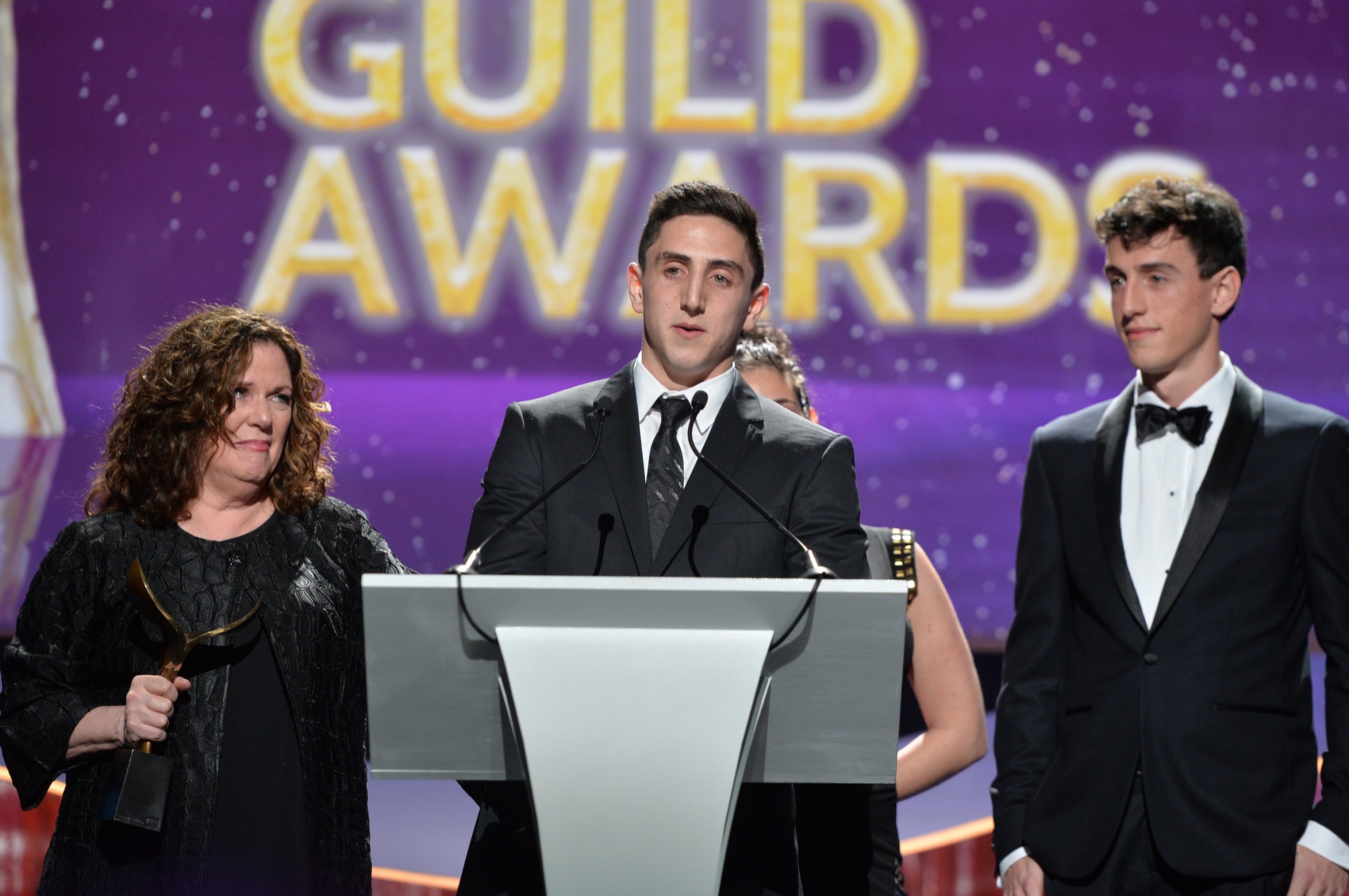 Daniel Ramis, Violet Ramis, Erica Mann Ramis, and Julian Ramis are pictured as they accept the Screen Laurel Award during the 2015 Writers Guild Awards L.A. Ceremony at the Hyatt Regency Century Plaza on February 14, 2015, in Century City, California | Source: Getty 