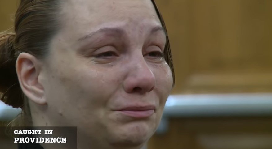 Female defendant crying during her court hearing | Source: Youtube/ Caught In Providence
