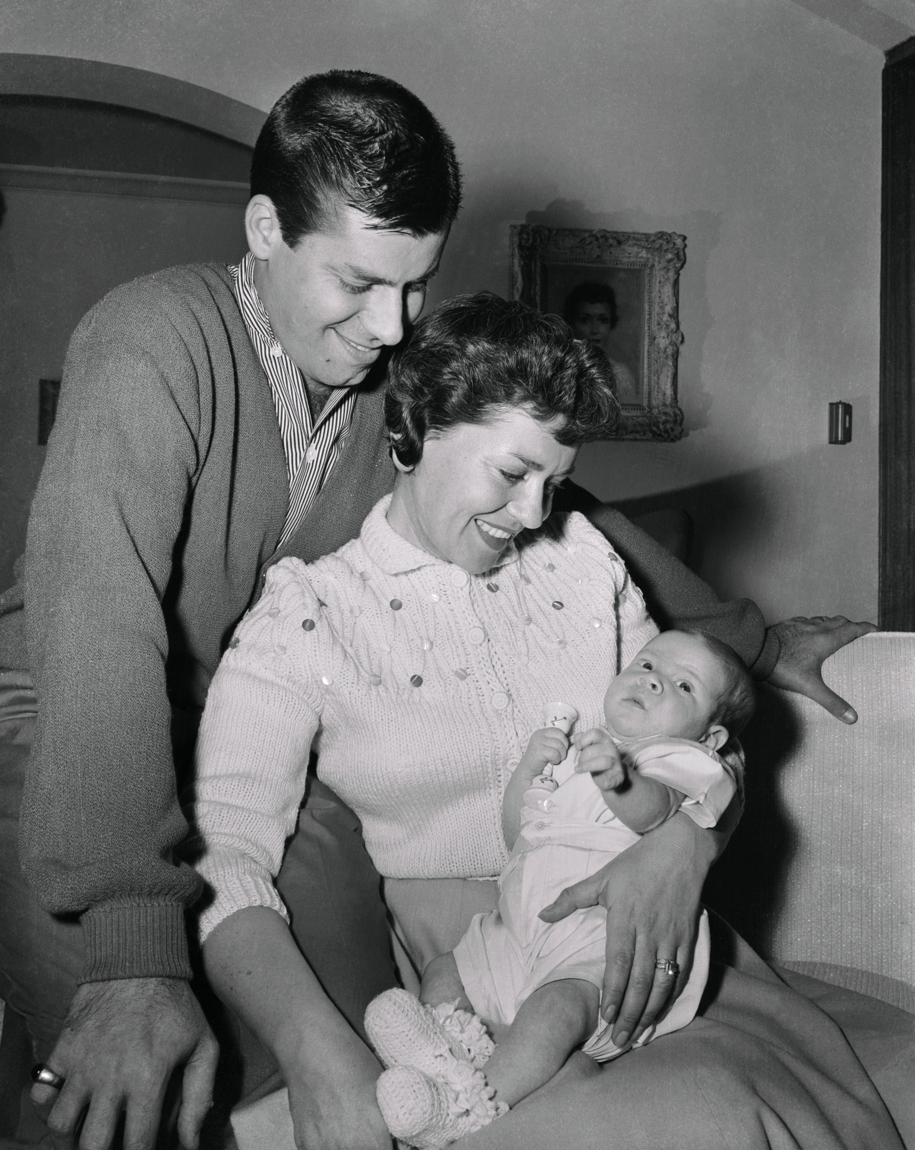 Jerry Lewis, Patti Lewis, and Baby Scott Anthony. April 12, 1956 | Source: Getty Images 