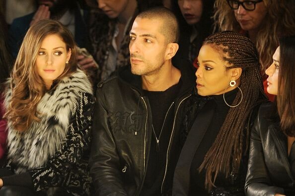 Wissam al Mana and Janet Jackson attend the Giorgio Armani fashion show during Milan Fashion Week. | Source: Getty Images