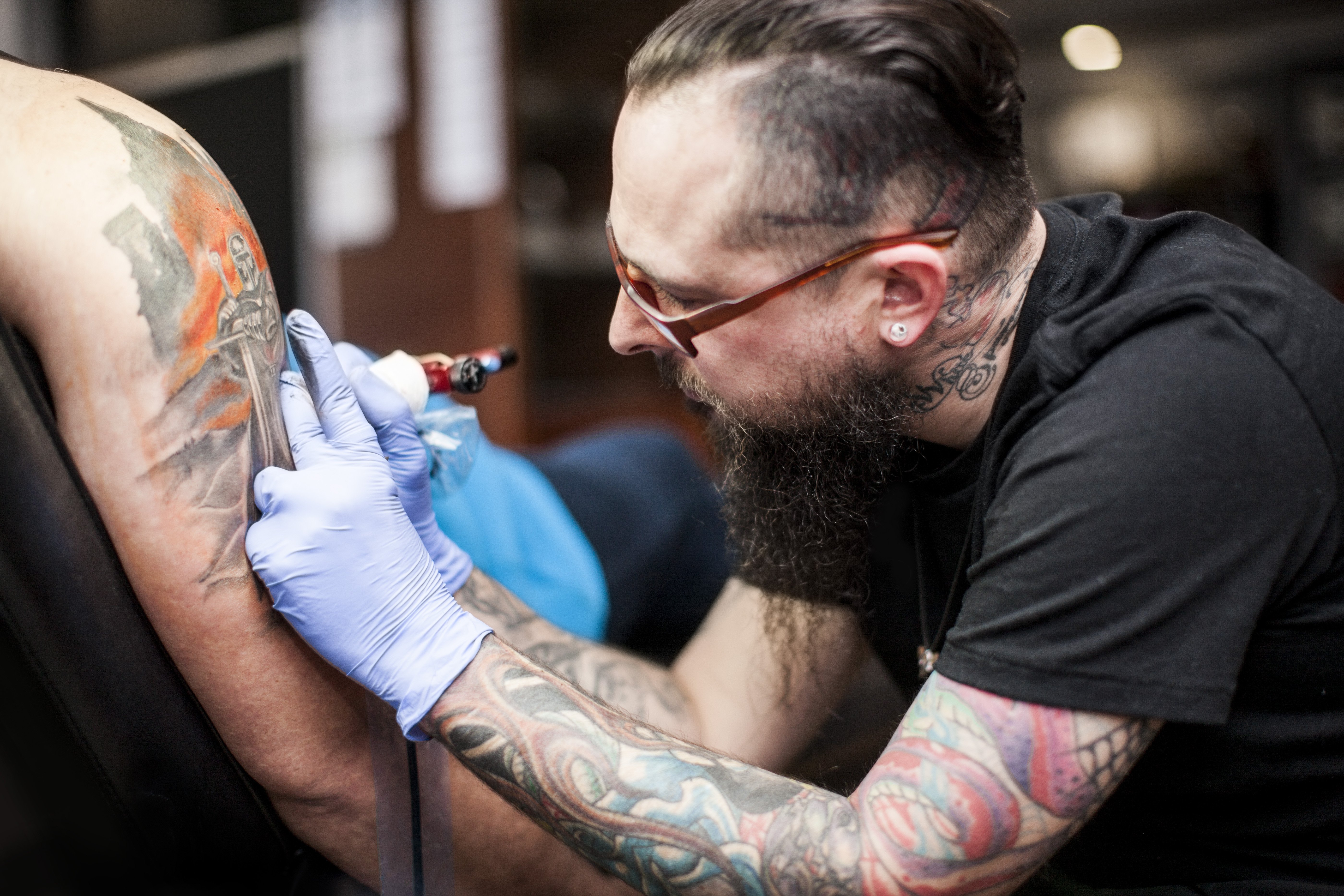 A tattoo artist at work | Source: Getty Images