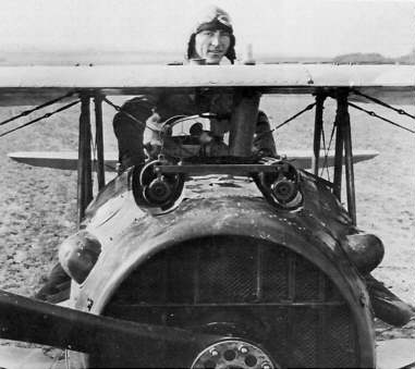 Then First Lieutenant Edward V. Rickenbacker, 94th Aero Squadron, American ace, standing up in his Spad plane near Rembercourt, France. | Source: Wikimedia Commons