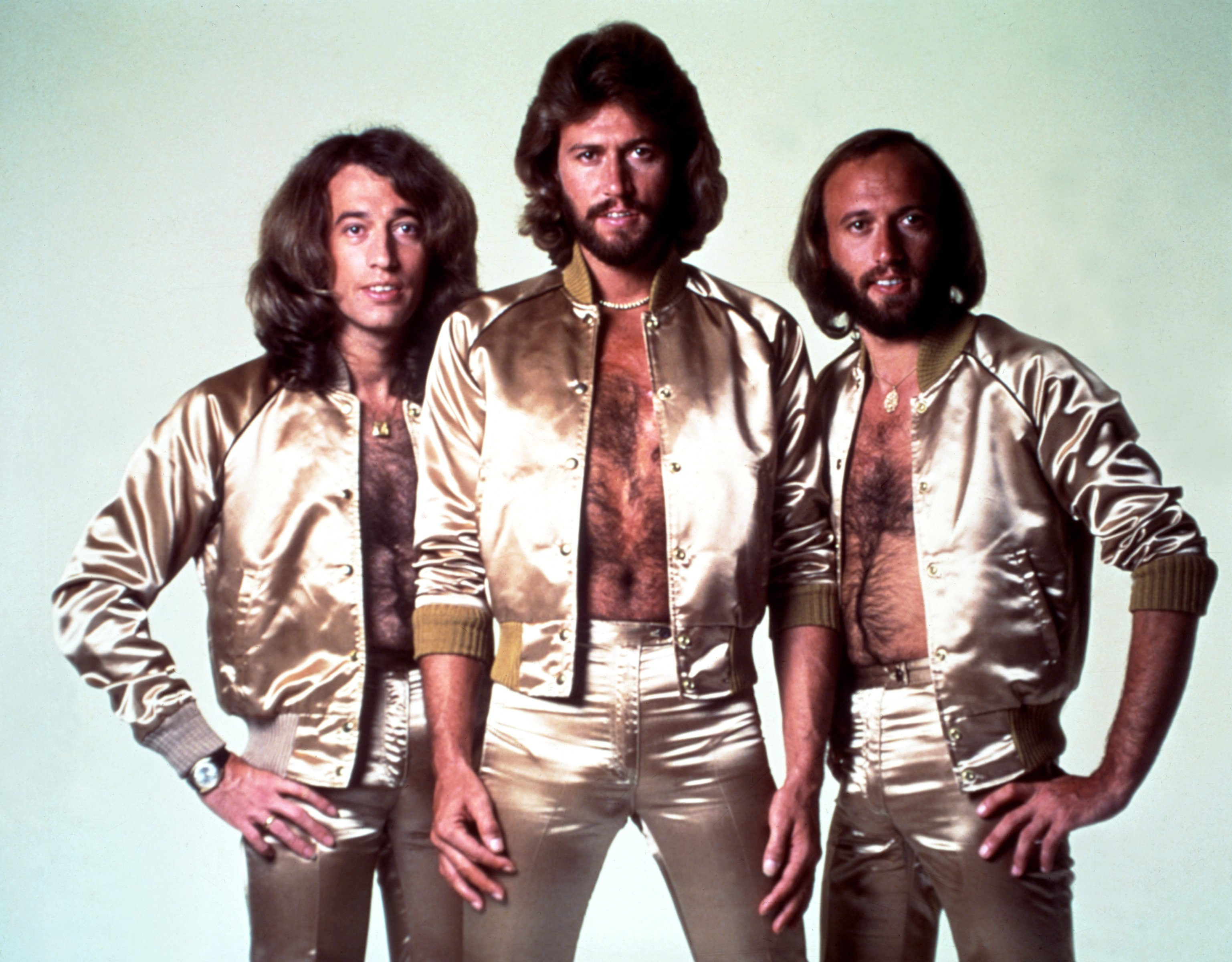 Disco group the Bee Gees pose for a portrait in gold lame outfits in 1977 | Source: Getty Images