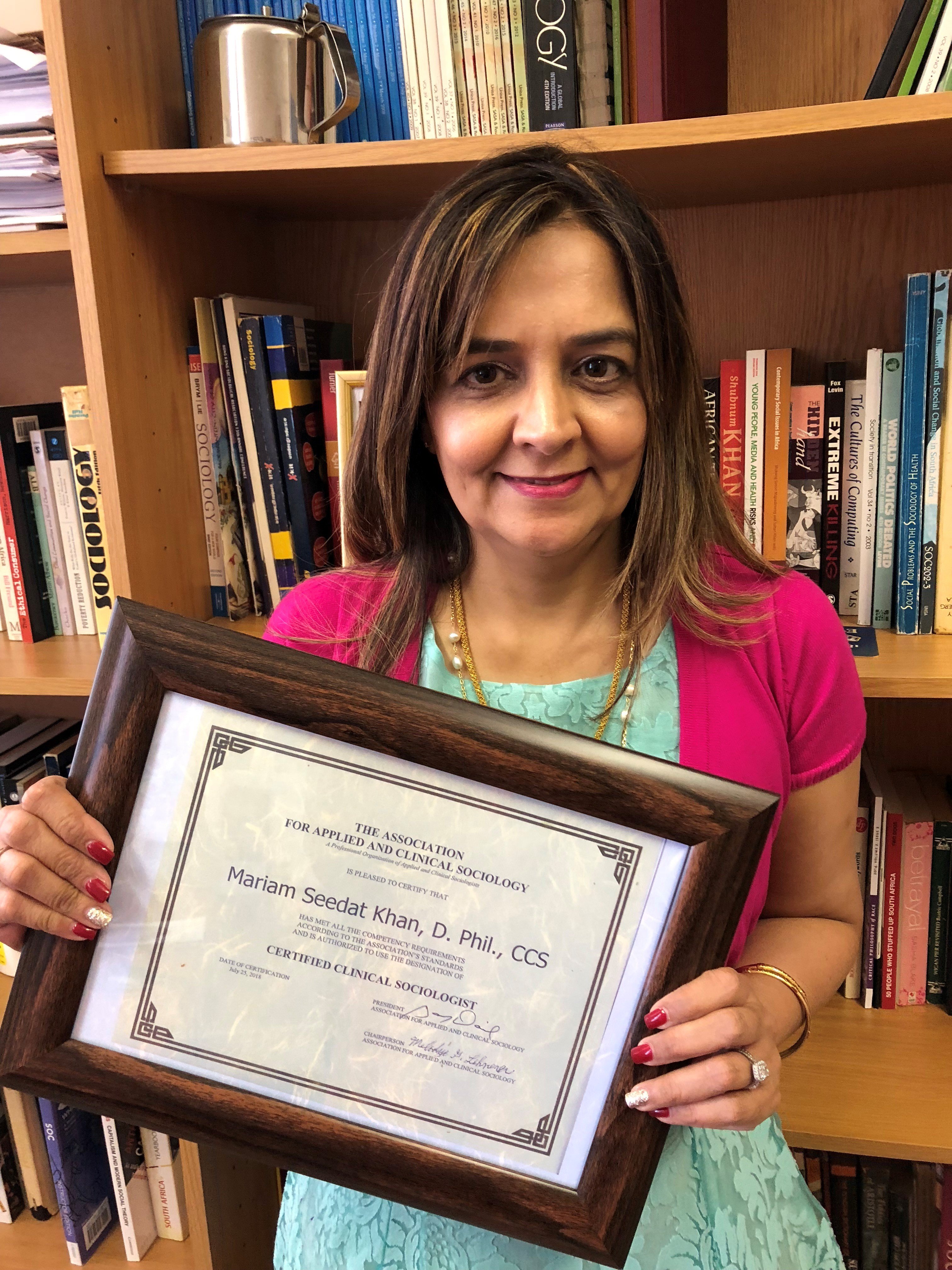 Mariam with her certificate from the Association for Applied and Clinical Sociology (AACS). | Source: Dr. Mariam Seedat Khan