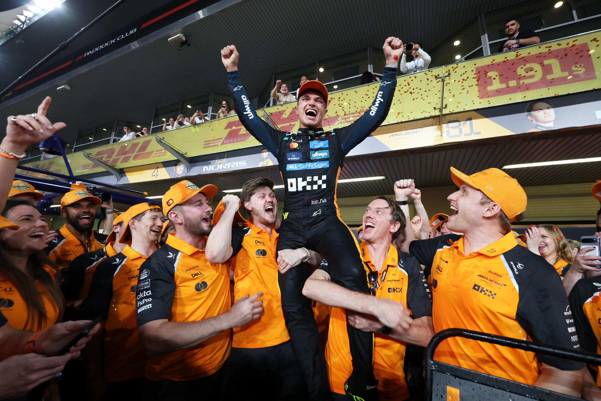 Lando Norris celebrates with his team on December 07, 2025 in Abu Dhabi, United Arab Emirates | Source: Getty Images