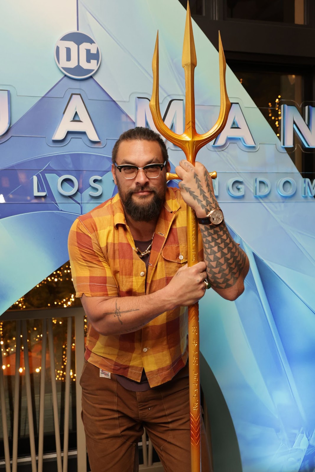 Jason Momoa at the "Aquaman and the Lost Kingdom" fan screening on December 18, 2023, in Los Angeles, California. Holding his iconic trident, Jason connected with fans while promoting the latest installment of his blockbuster film series, embodying his beloved character. | Source: Getty Images