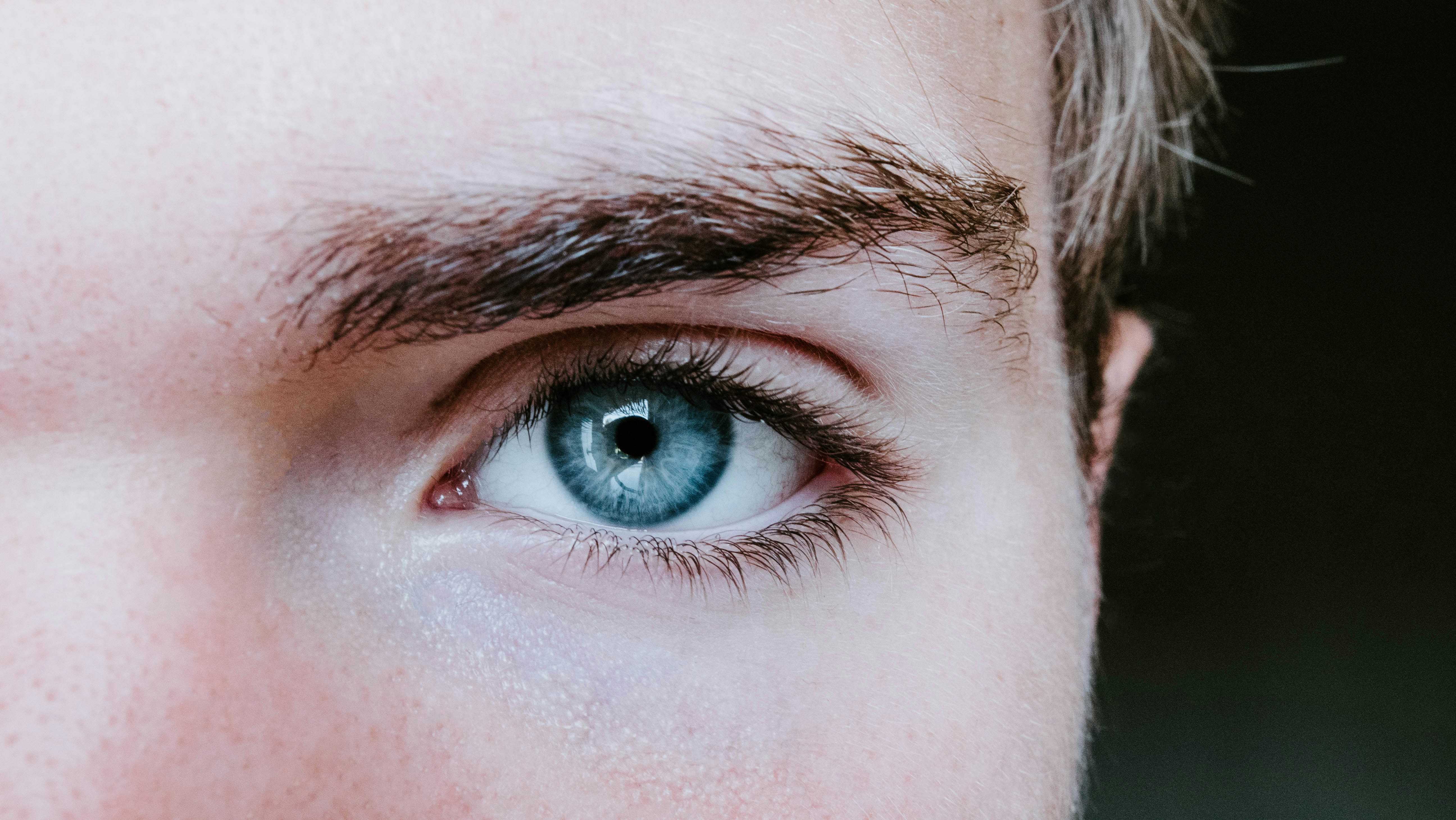 A close-up of a man's eye | Source: Unsplash