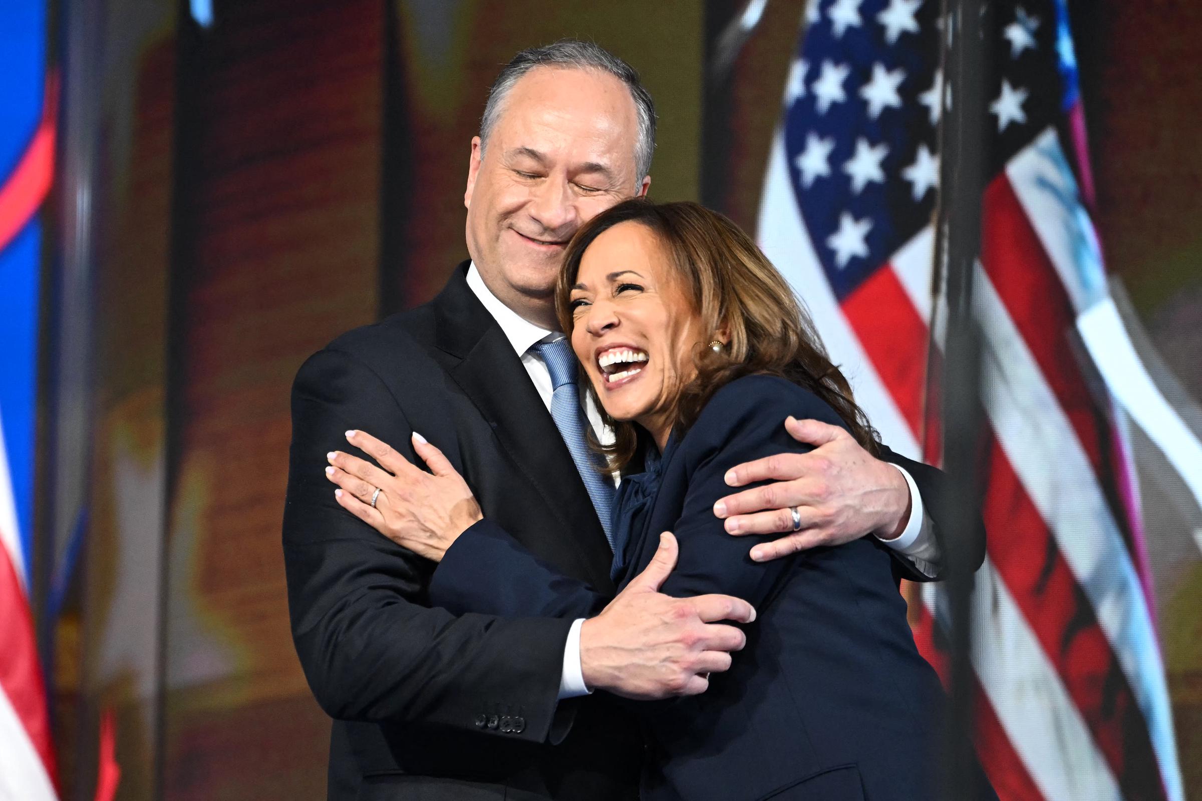 Doug Emhoff and Kamala Harris sharing a tender hug during the Democratic National Convention. | Source: Getty Images