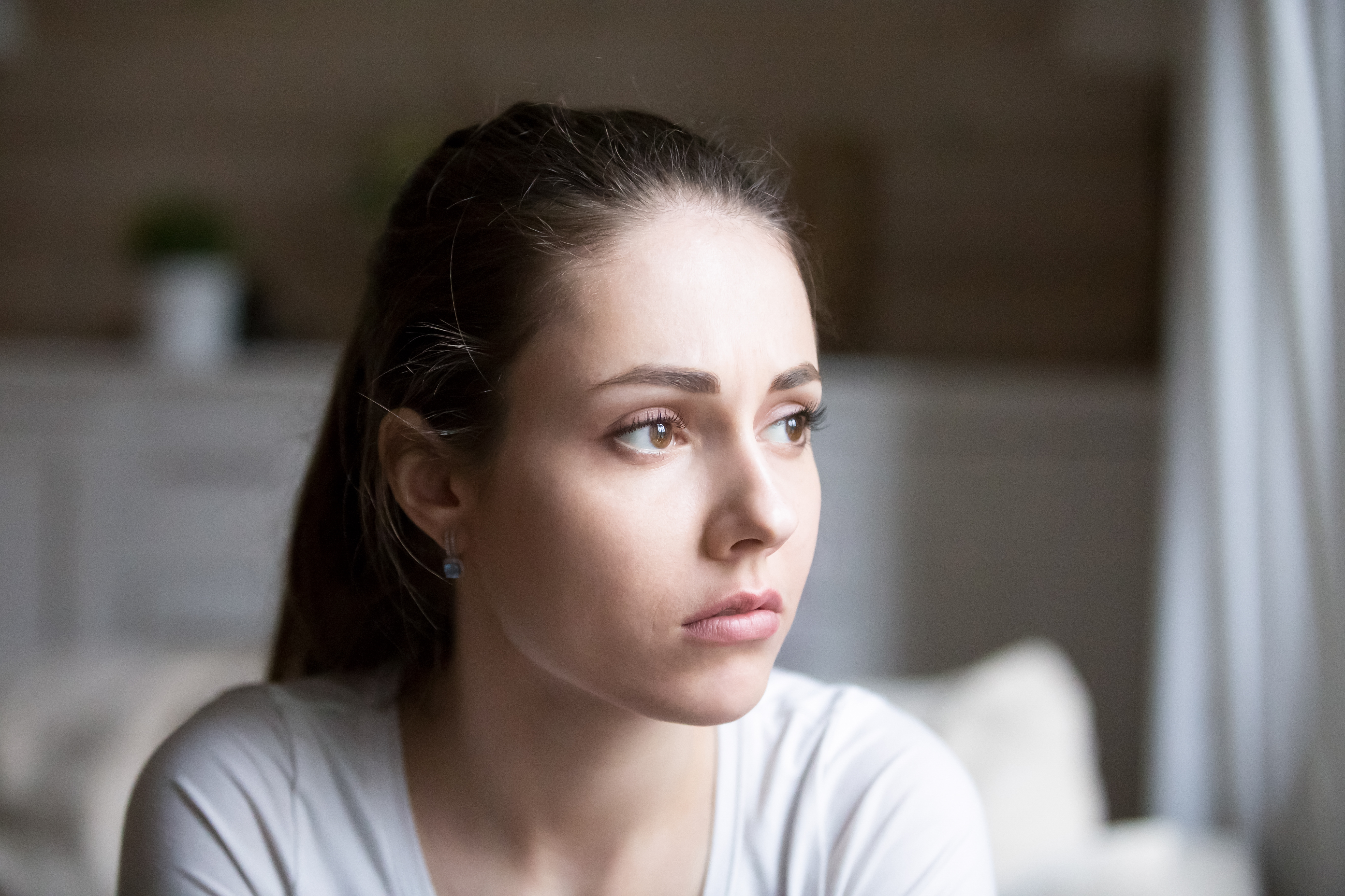 Young woman looking sad | Source: Shutterstock