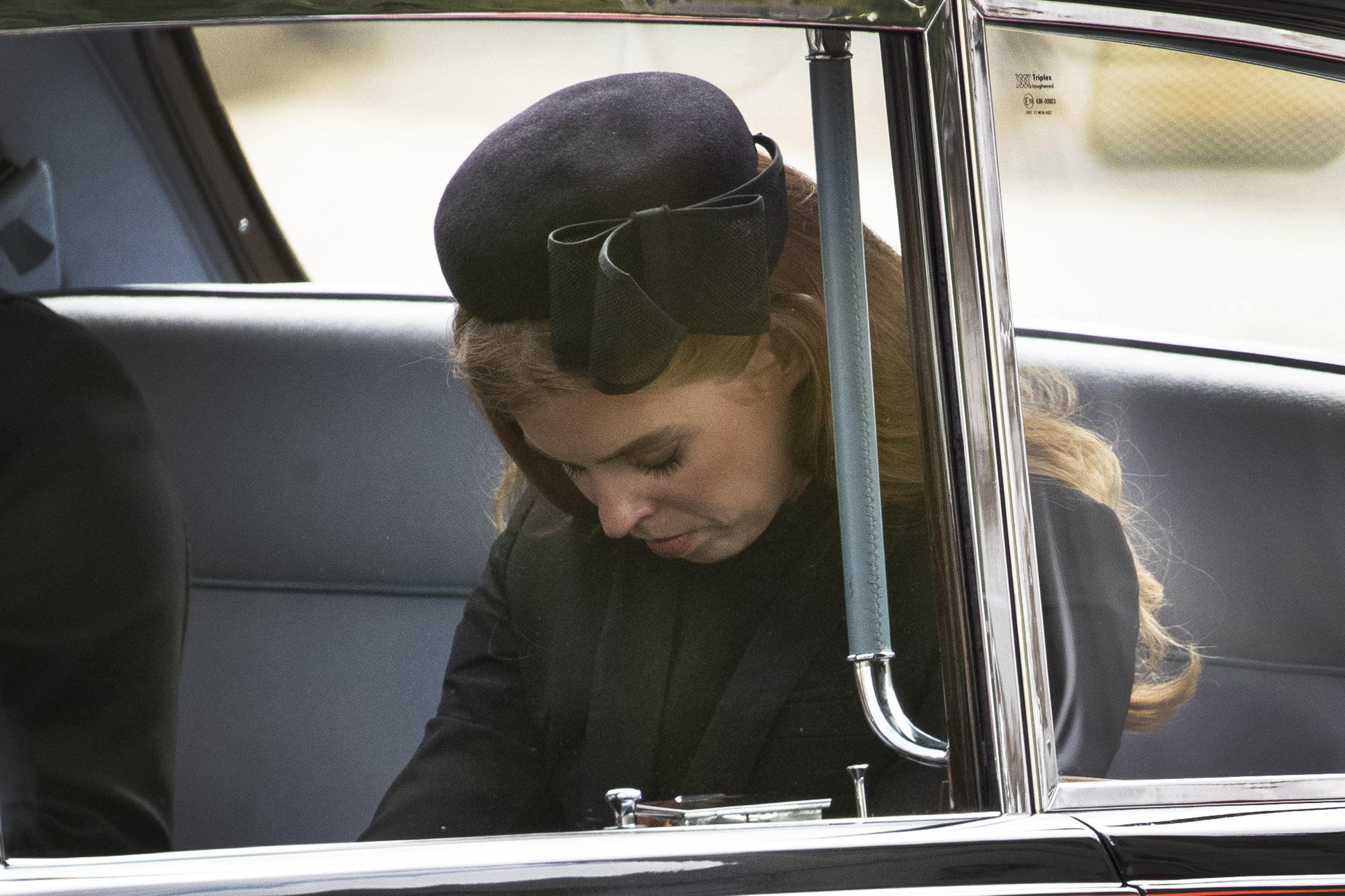 Princess Beatrice of York looks emotional as she follows the cortège of the late Queen Elizabeth II as it is pulled past the Houses of Parliament after her funeral at Westminster Abbey on September 19, 2022 in London, England | Source: Getty Images 