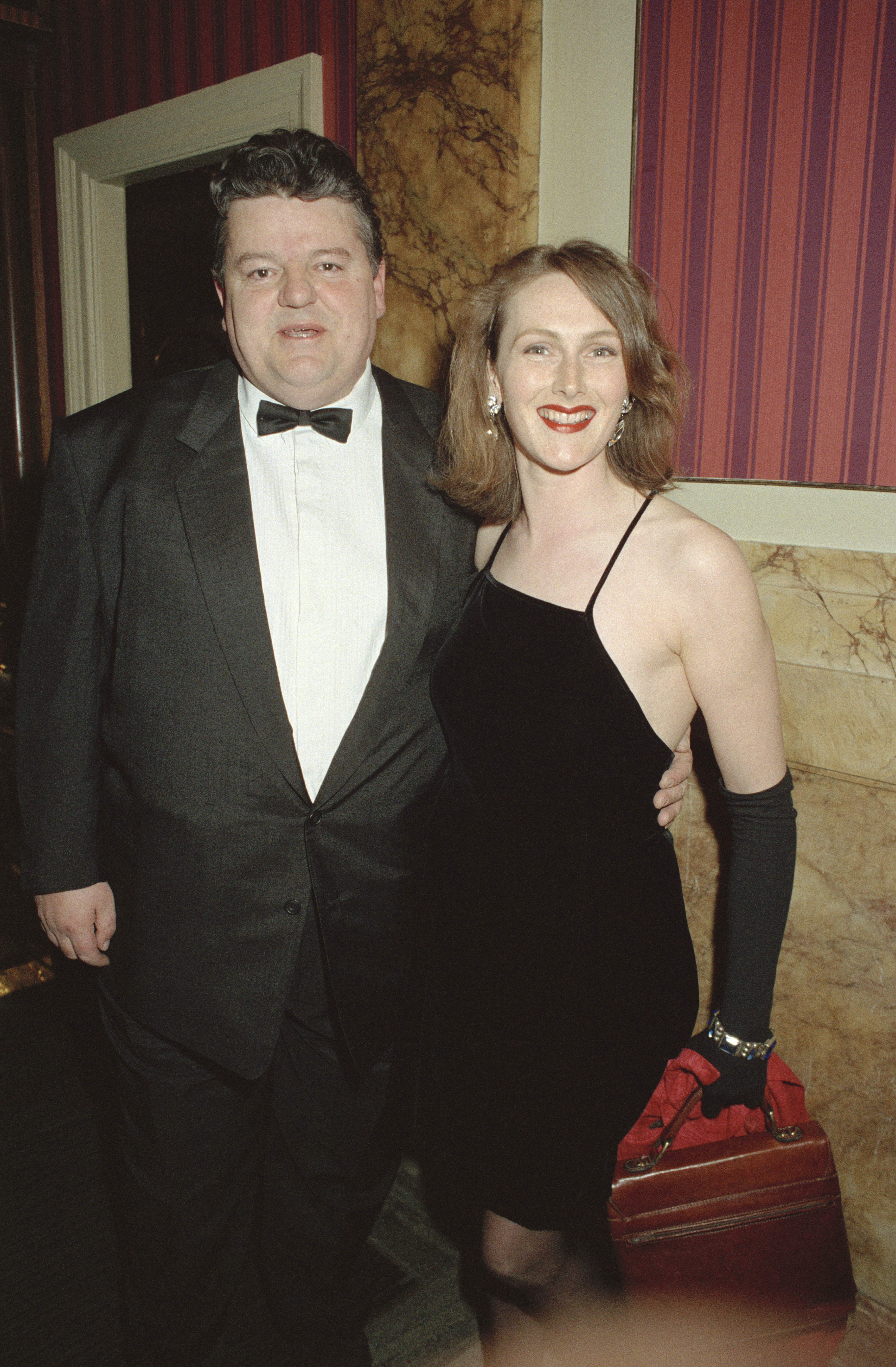 Robbie Coltrane and Rhona Gemmell are photographed at The BAFTA Awards at the London Palladium on April 24, 1995, in London, England | Source: Getty Images