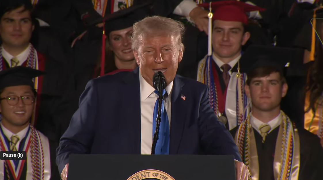 Donald Trump smiles as he begins his weightlifting anecdote during the University of Alabama commencement ceremony on May 1, 2025 | Source: YouTube/WhiteHouse