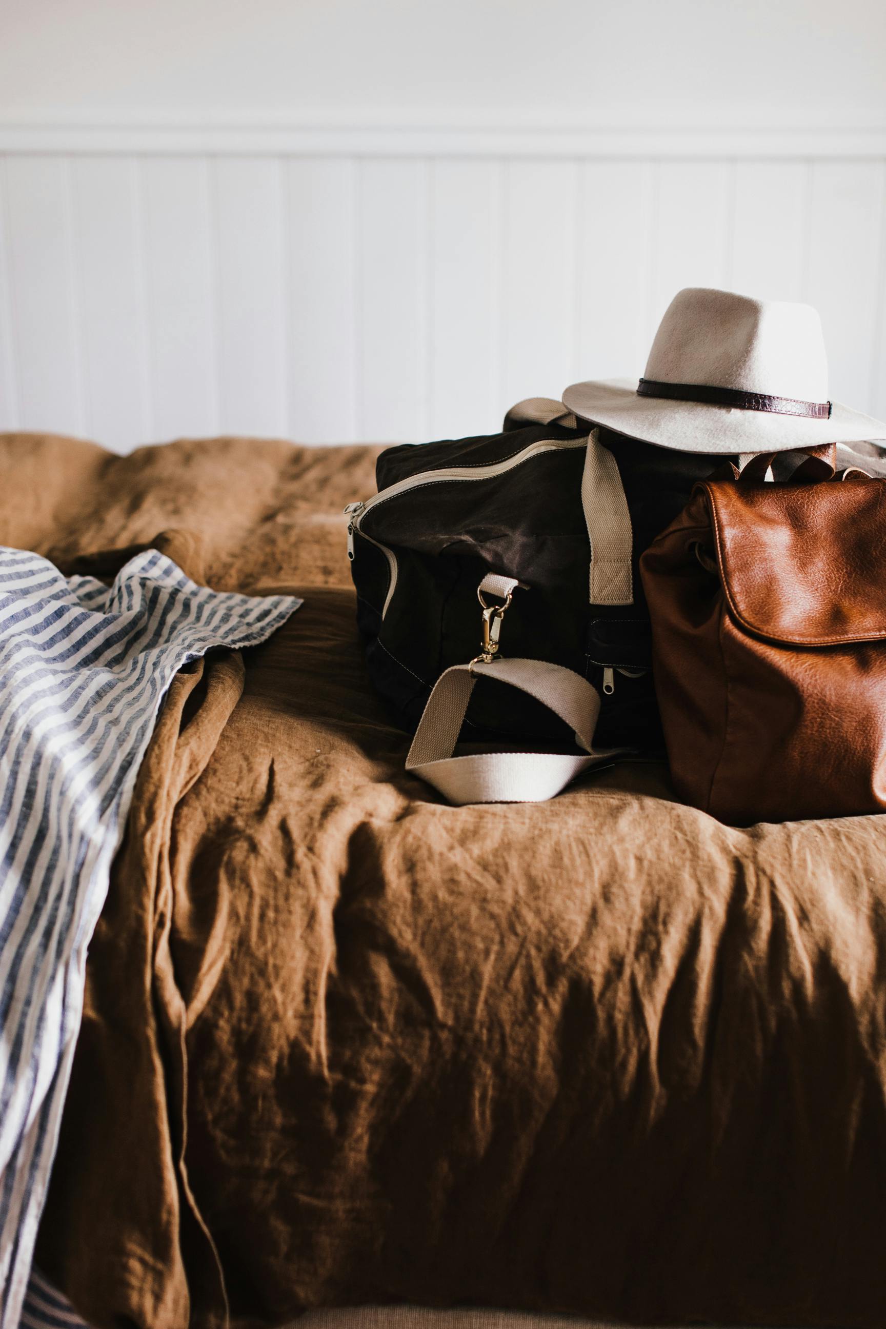 Travel bags on a bed | Source: Pexels