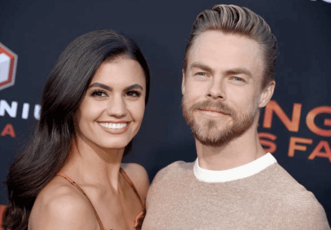 Derek Hough and his girlfriend, Hayley Erbert pose on the red carpet as they arrive at the  "Angel Has Fallen" premiere, on August 20, 2019, in Westwood, California | Source: Getty Images (Photo by Gregg DeGuire/FilmMagic,)