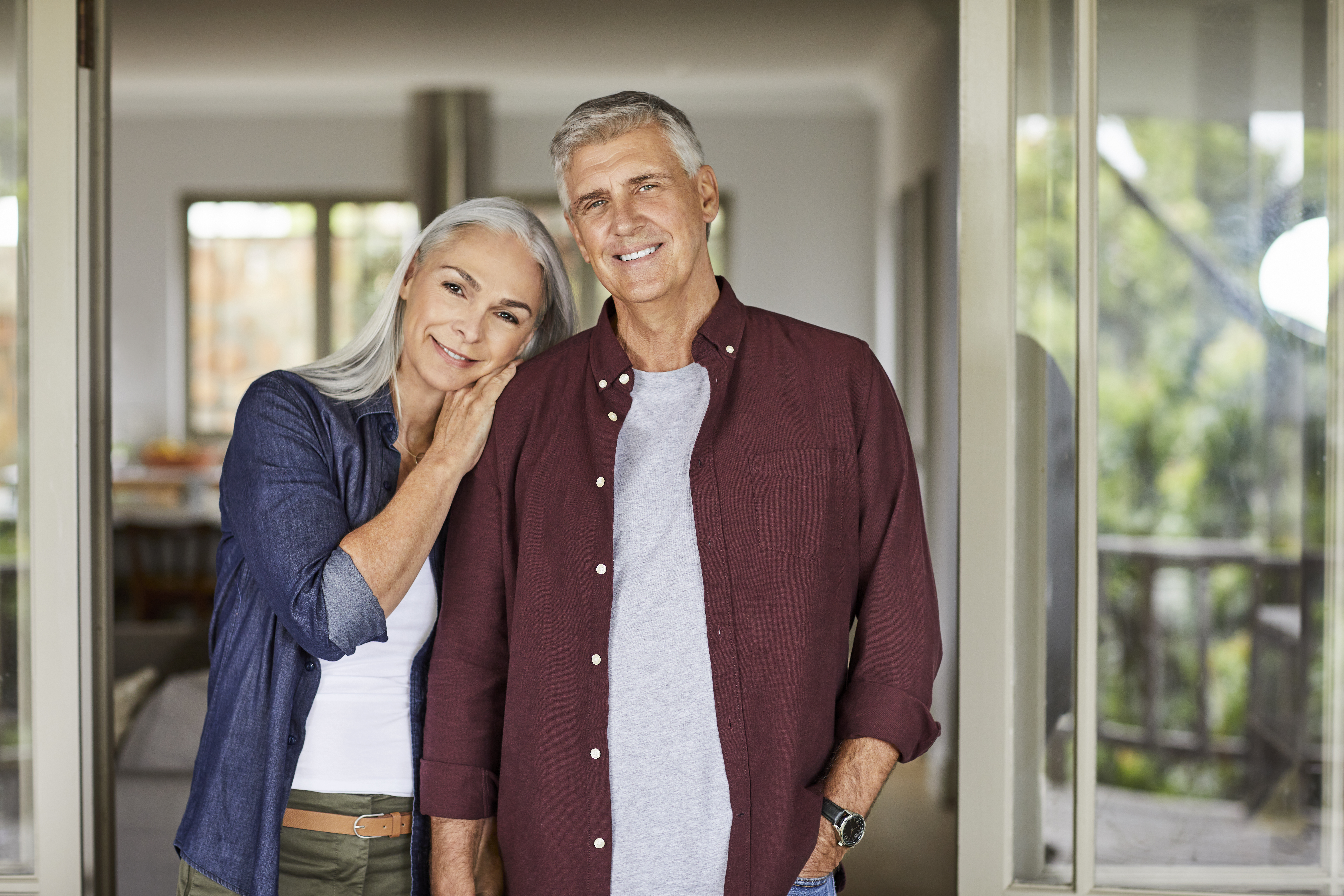 Smiling mature couple at home during lockdown | Source: Getty Images