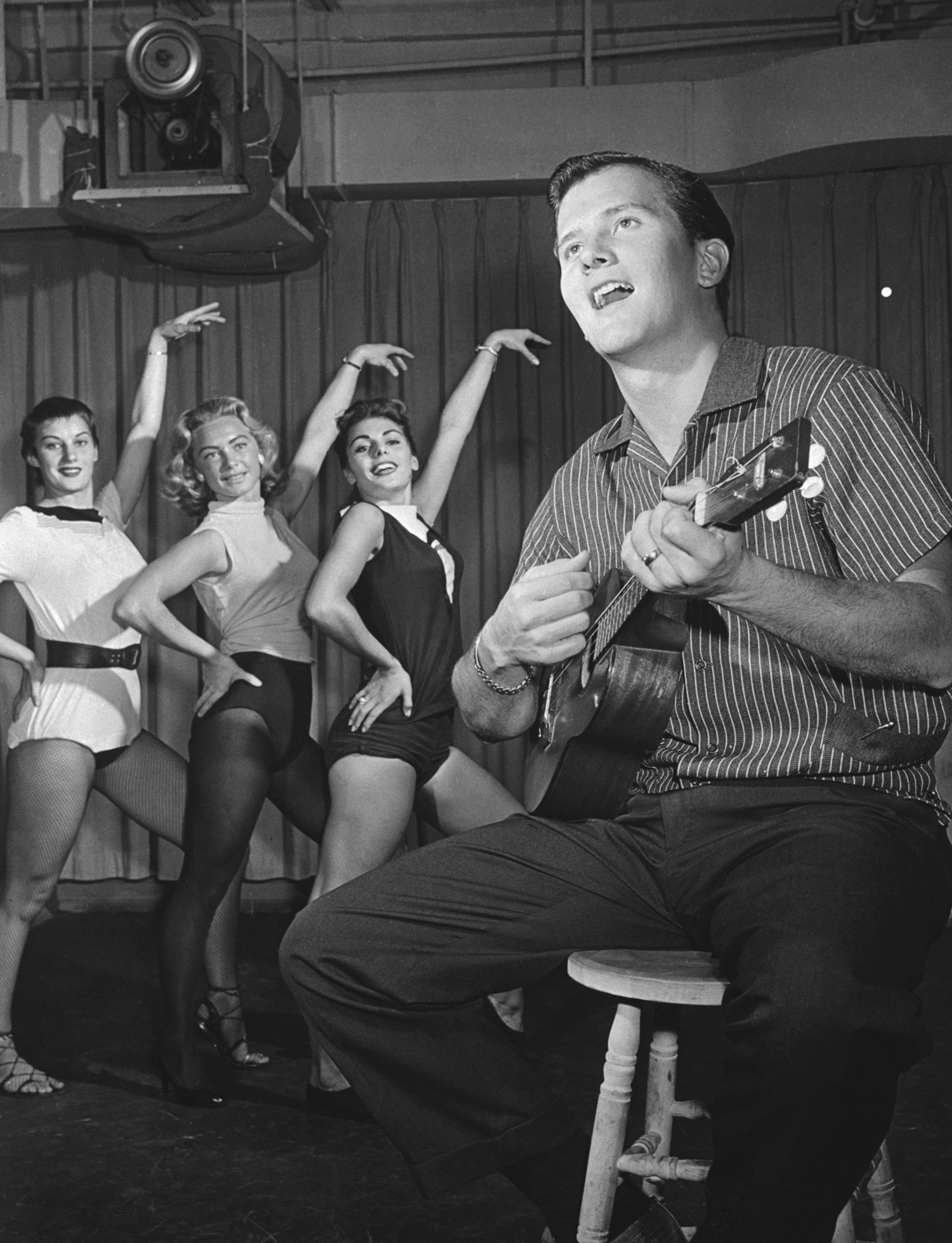 Pat Boone rehearsing a routine with the dance group of ABC-TV's "The Pat Boone Chevy Showroom," circa 1957. | Source: Getty Images