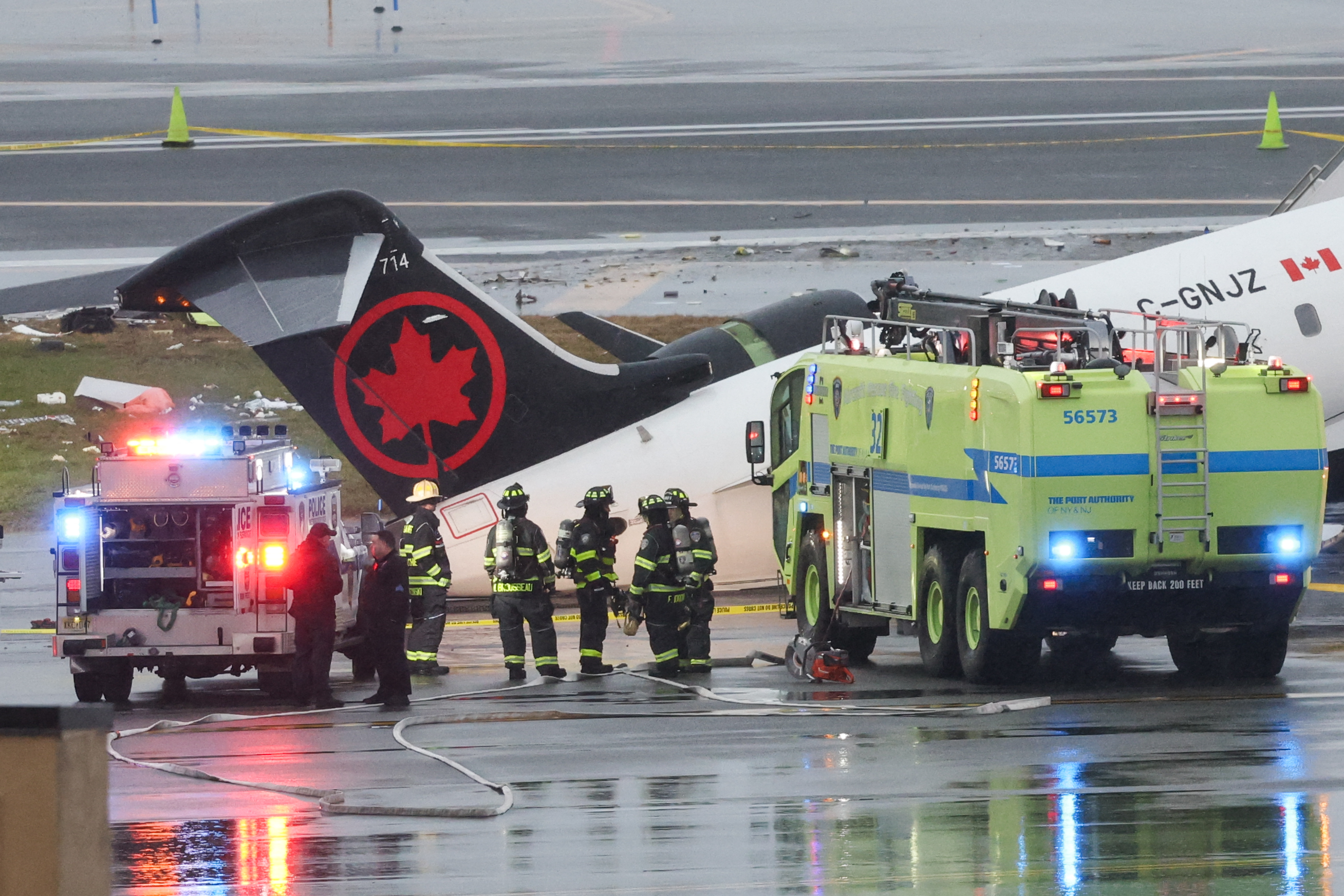 Emergency responders work at the scene where an Air Canada Express CRJ-900 sits on the runway after colliding with a Port Authority fire truck at LaGuardia Airport on March 23, 2026, in New York City | Source: Getty Images