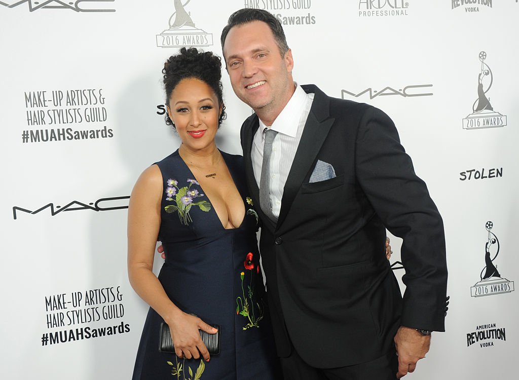 Actress and TV host Tamera Mowry- Housley and husband Adam Housley attend the 2016 Make-up Artist and Hairstylist Guild Awards in Hollywood, California. | Photo: Getty Images
