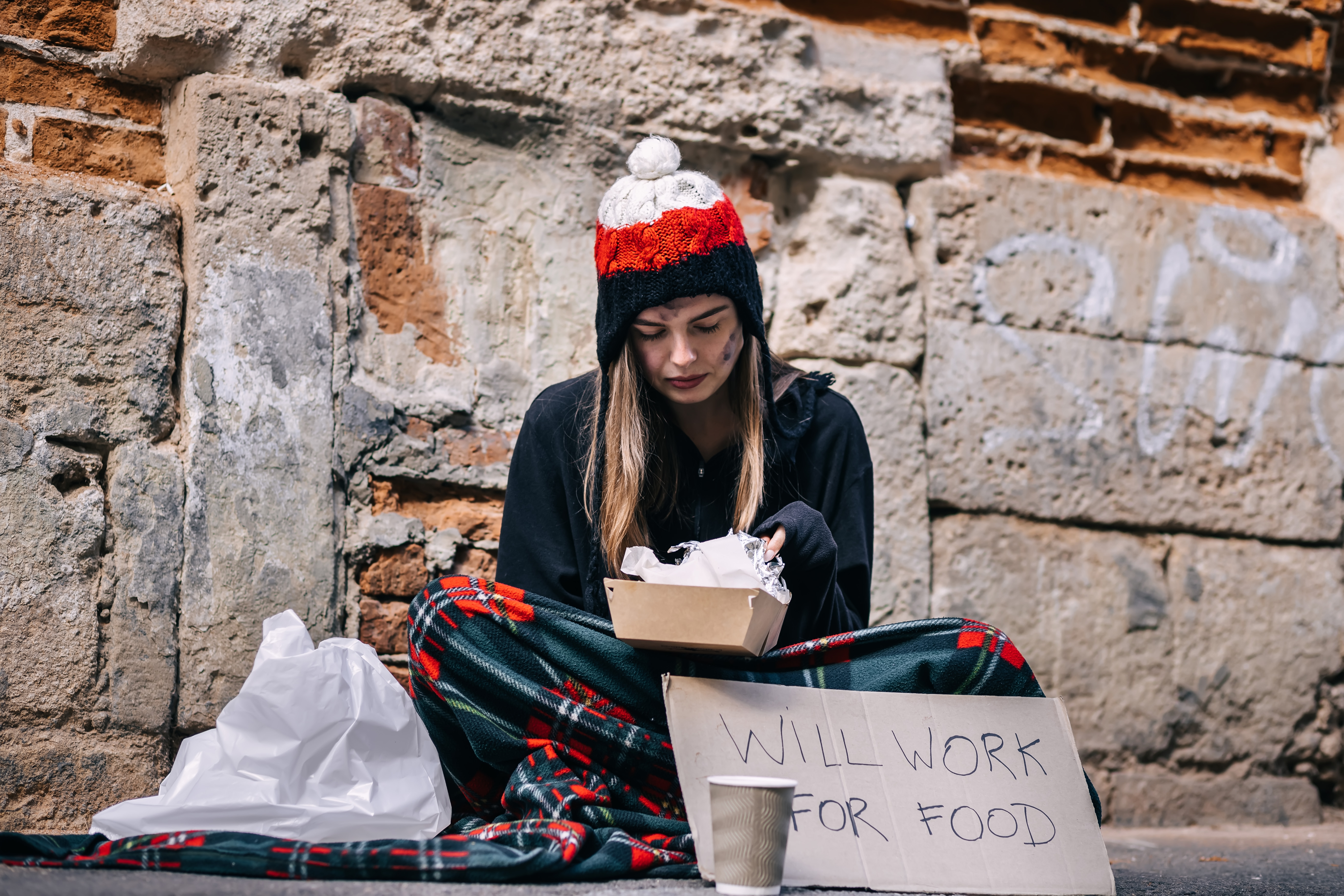 A young girl living on the streets | Source: Shutterstock