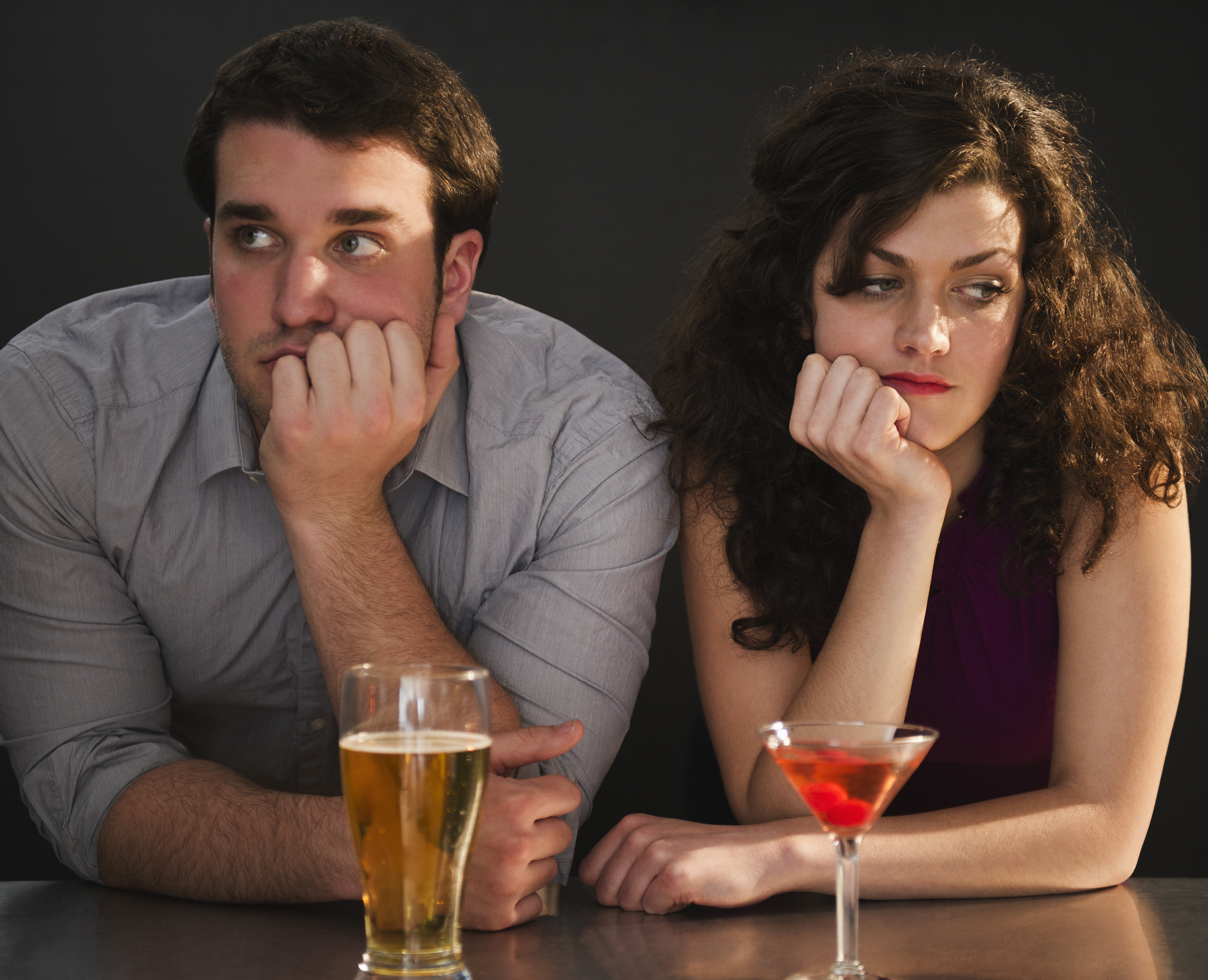 Bored couple sitting at a bar | Source: Getty Images