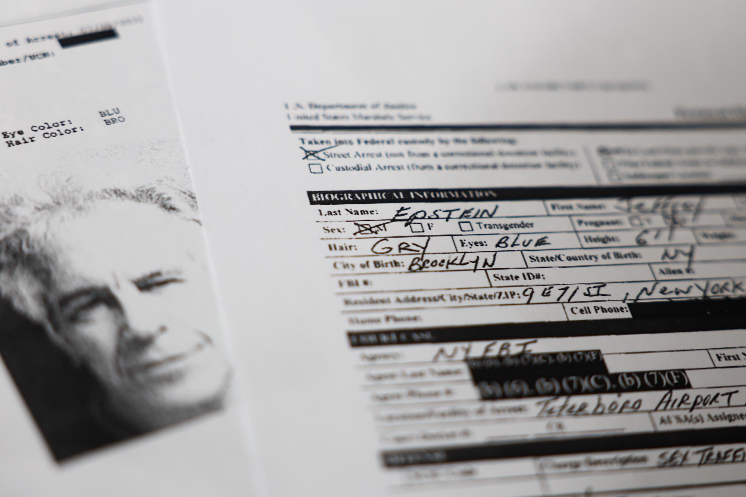Printed documents available at Epstein Library on the U.S. Department of Justice website are seen in this illustration photo taken in Krakow, Poland on February 17, 2026. | Source: Getty Images