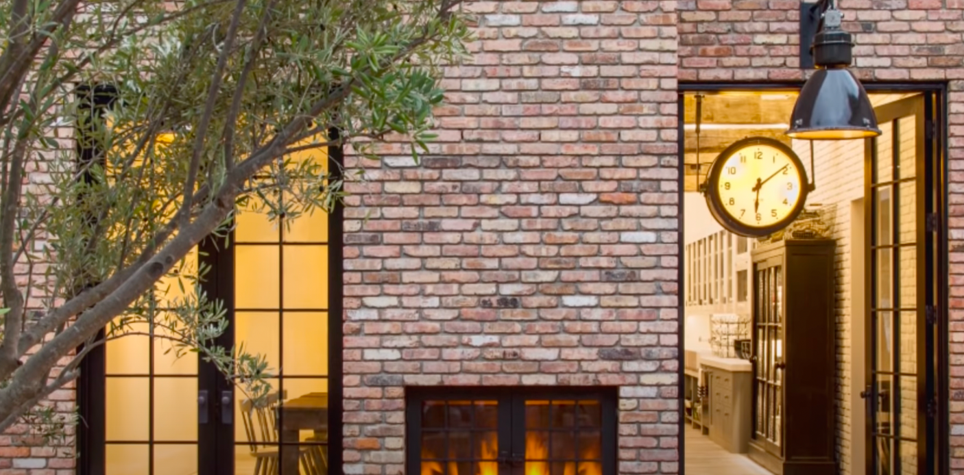 A screenshot from a YouTube video of the outdoor fireplace of Keaton's farmhouse-inspired home posted on February 3, 2022 | Source: Youtube.com/Famous Entertainment