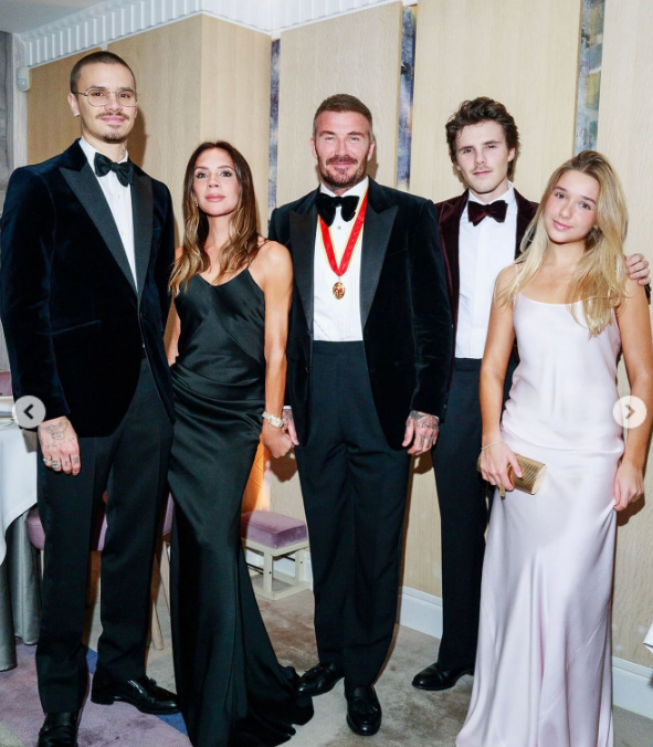 Victoria, David, Cruz, Romeo, and Harper Beckham dress formally to celebrate the soccer star's knighthood from King Charles III in a post dated November 5, 2025 | Source: Instagram/victoriabeckham