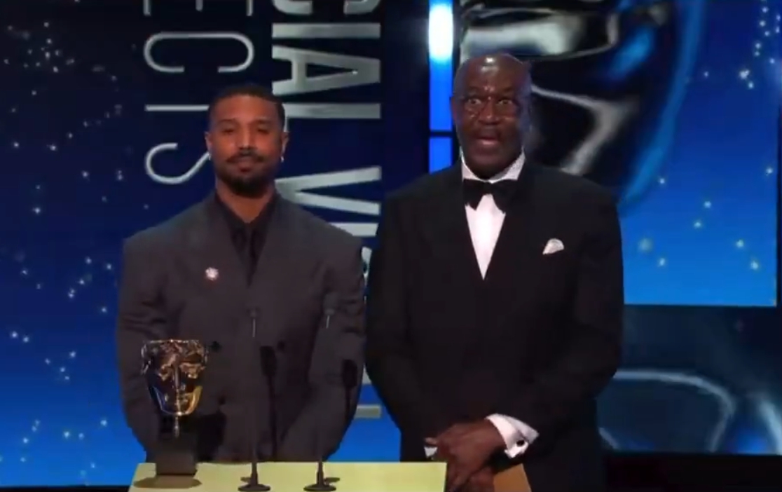 Michael B. Jordan and Delroy Lindo react to a controversial moment at 79th BAFTA Film Awards at The Royal Festival Hall on February 22, 2026, in London, England | Source: X/ANTHONYBLOGAN