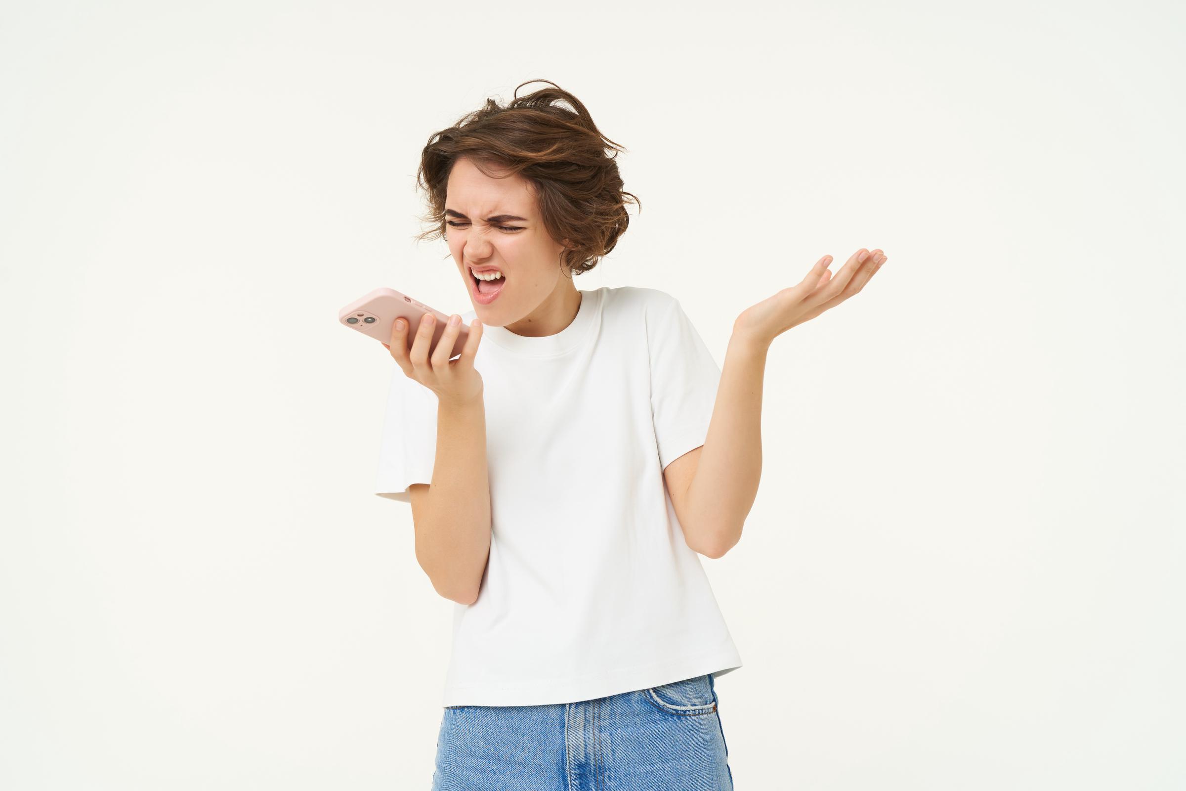 A shouting woman on her phone | Source: Freepik