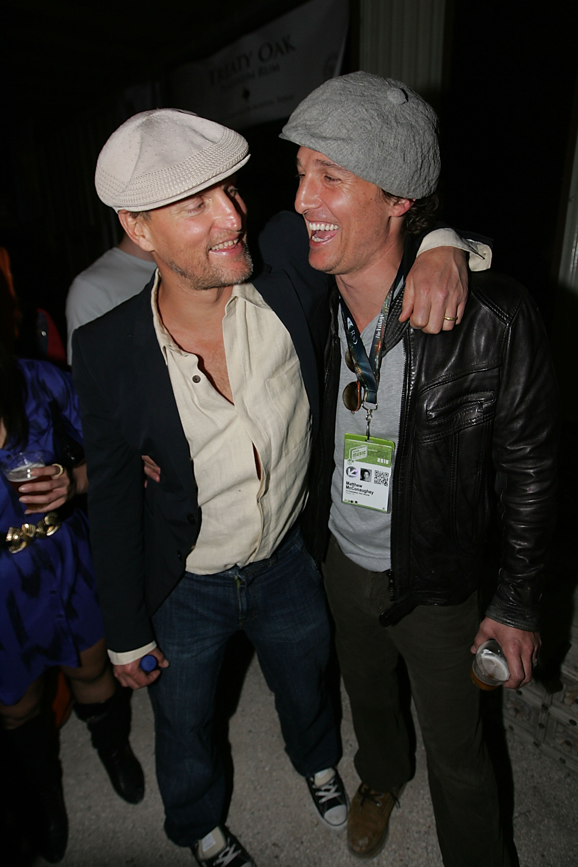 Woody Harrelson and Matthew McConaughey enjoying the music of John Popper during the Bliss Lounge Party, a charity event benefiting H.O.P.E., held at Big Red Sun in Austin, Texas, on March 19, 2010 | Source: Getty Images